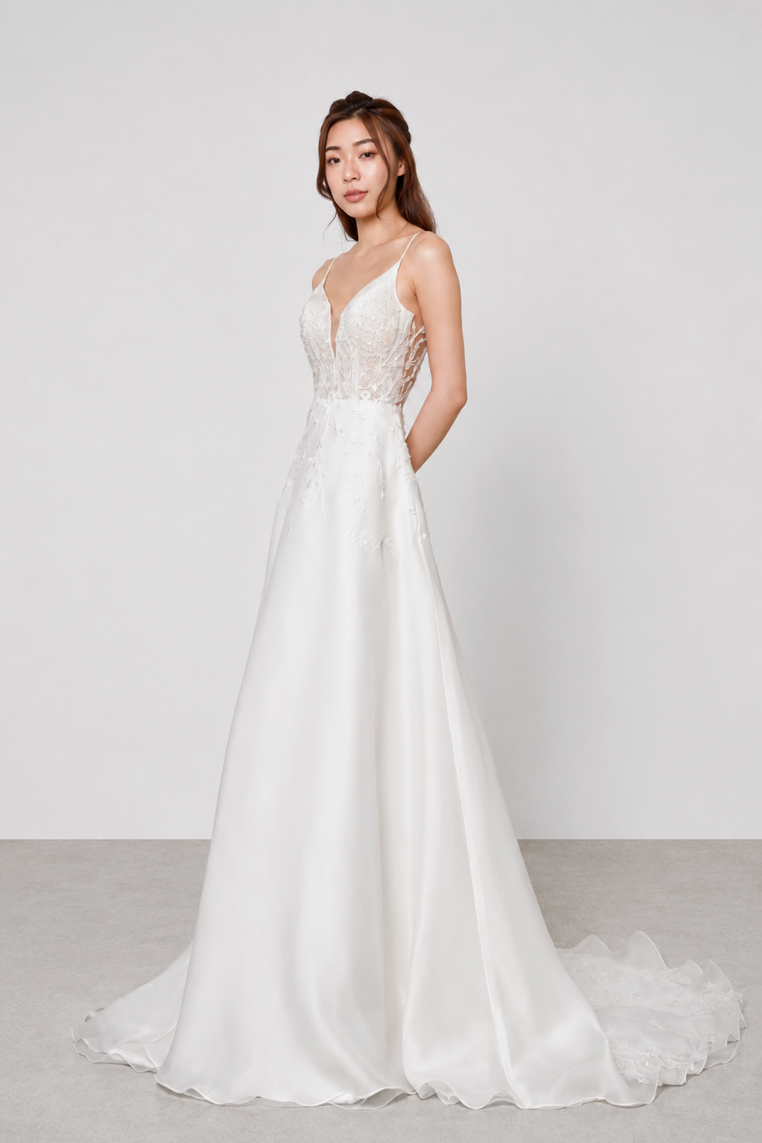 Phoebe bridal gown front view with a beaded lace bodice and spaghetti straps