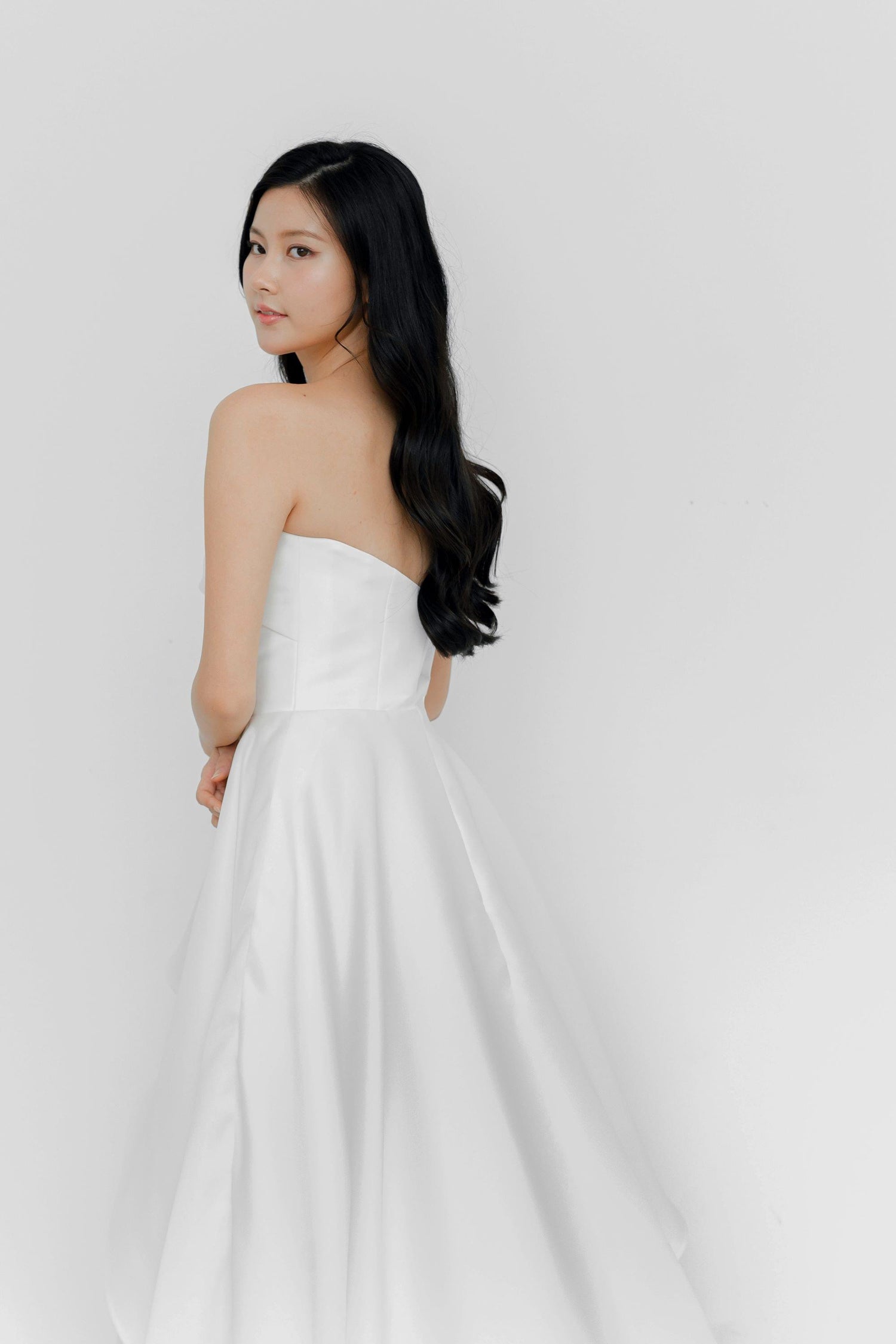 Arabelle bridal gown back view with an elegant flowing silhouette