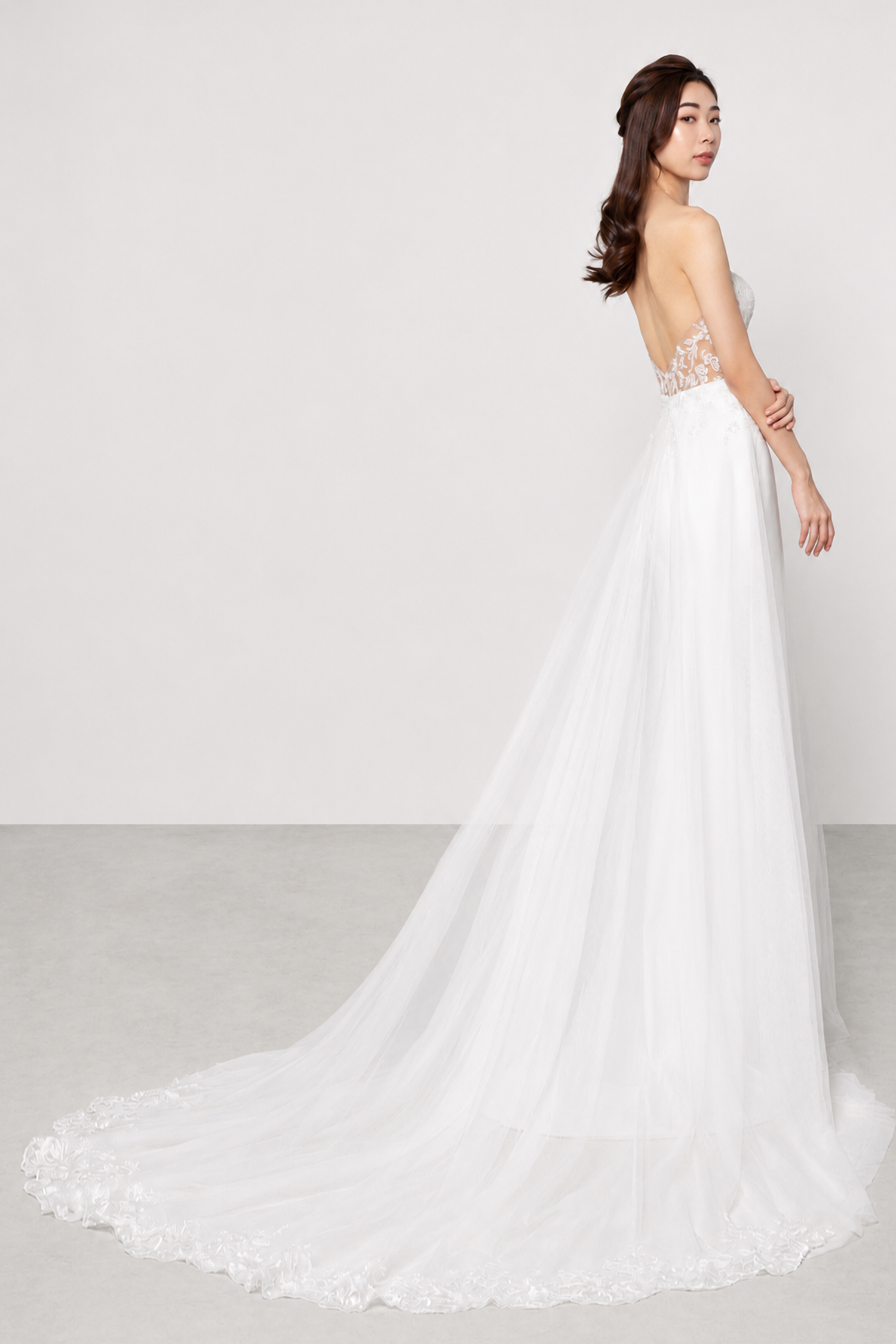 Aries bridal gown train showcasing the elegant crepe skirt and graceful silhouette