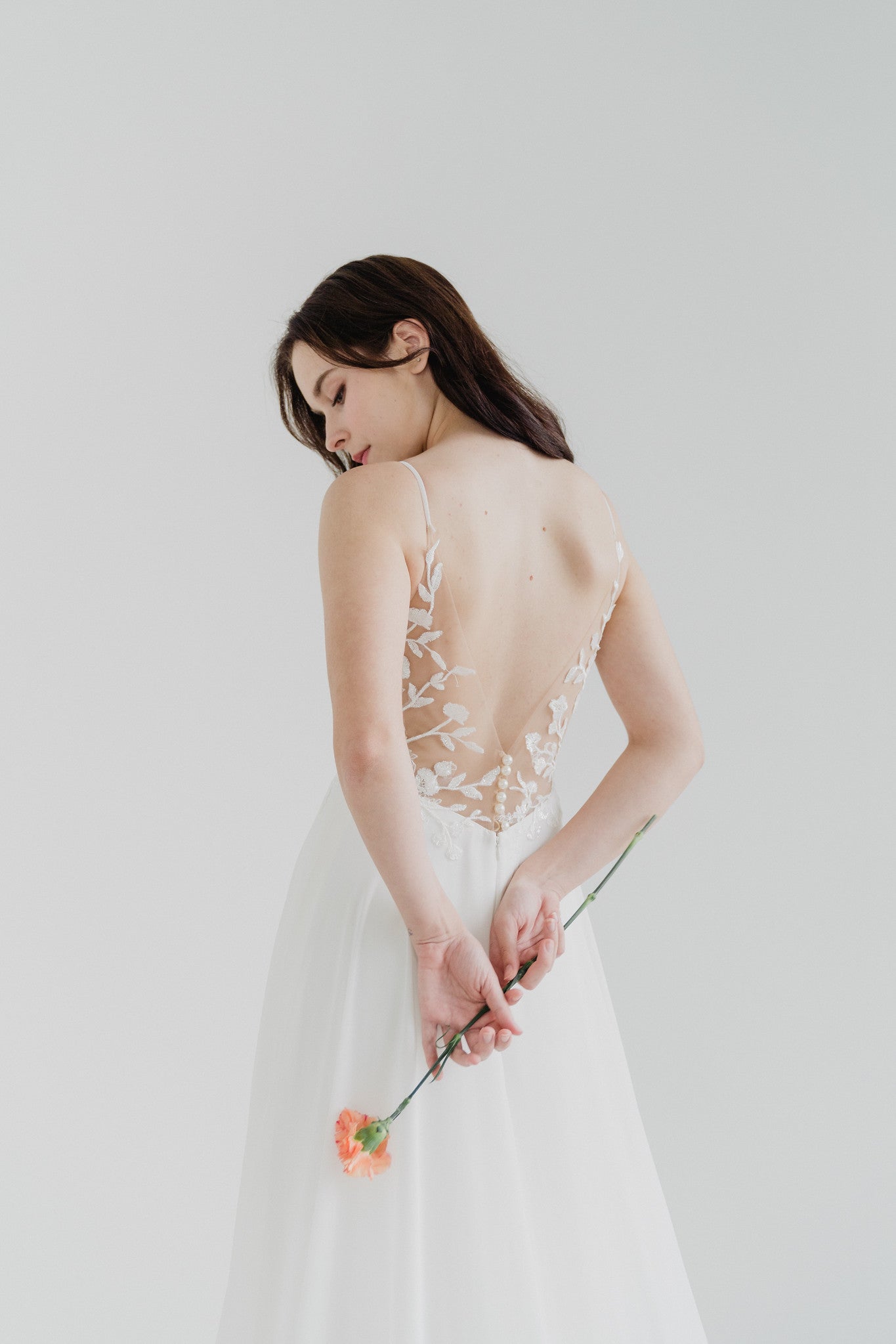 Close-up of Aveline bridal gown with scalloped lace detailing
