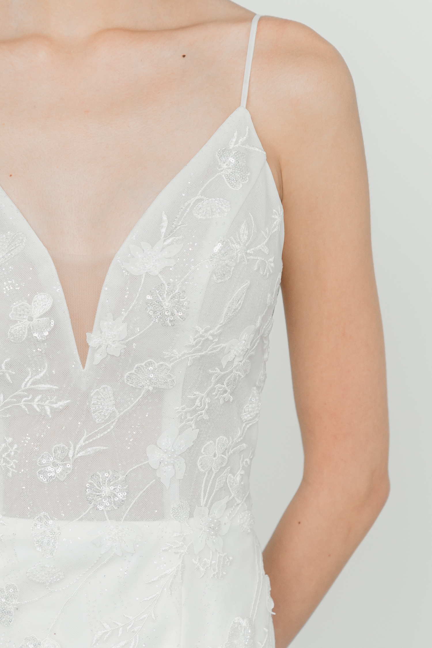Close-up of Bianca wedding dress with sparkling floral lace detailing