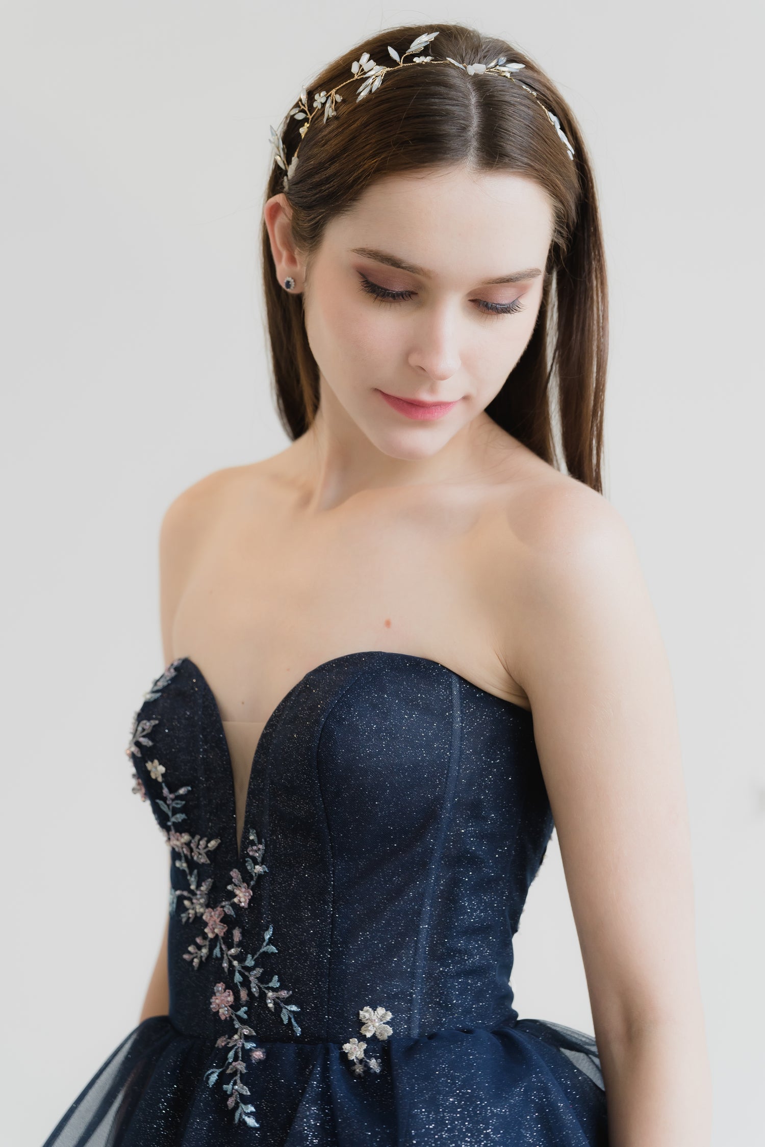 Close-up of Brenda bridal evening gown showcasing the sweetheart bodice and cascading lace
