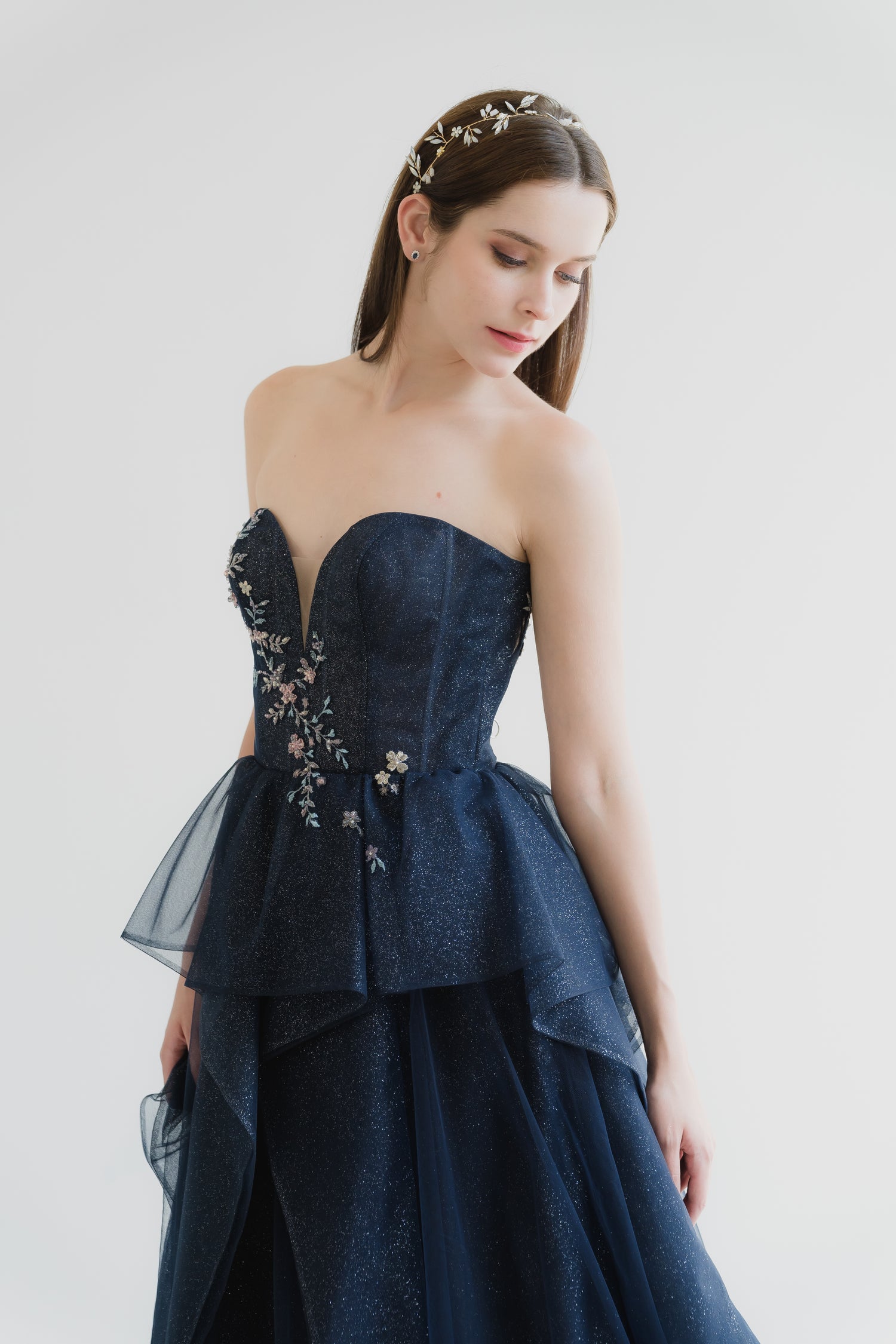 Brenda bridal evening gown front view with a sweetheart neckline and cascading floral lace