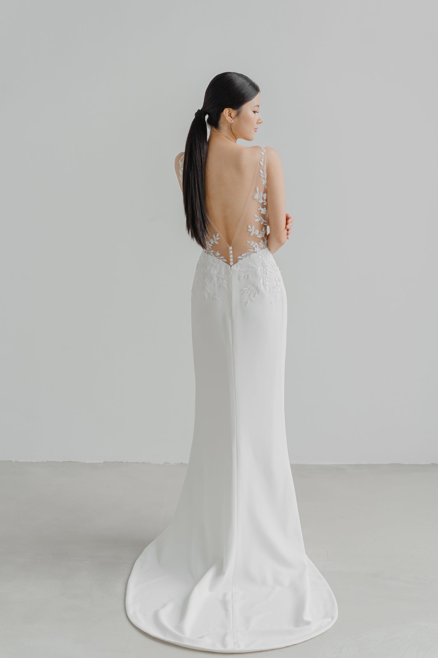 Brianna bridal gown back view with a graceful fitted silhouette