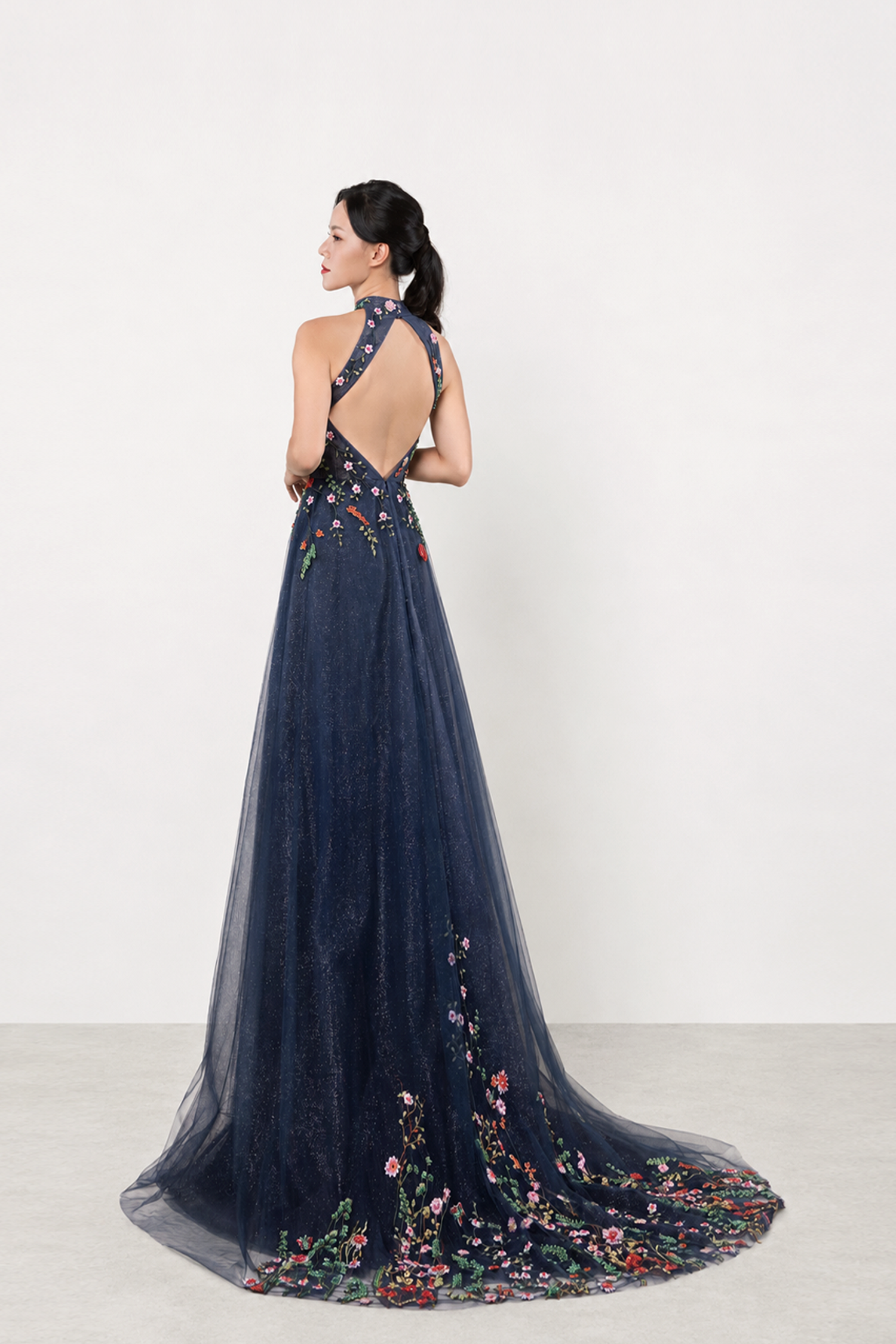 Bridget bridal cheongsam back view with intricate floral embroidery