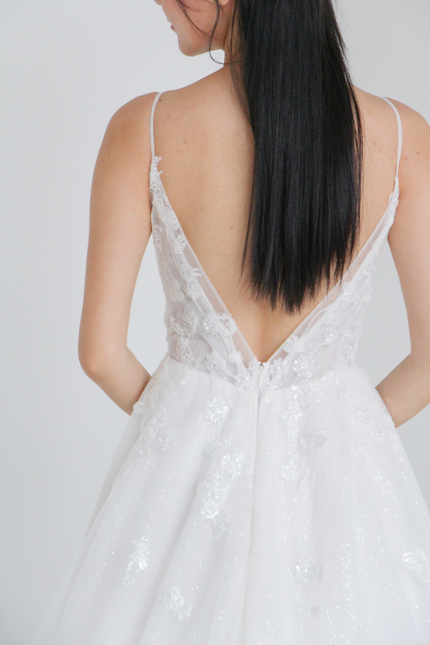 Caitlyn wedding dress back view with delicate floral lace