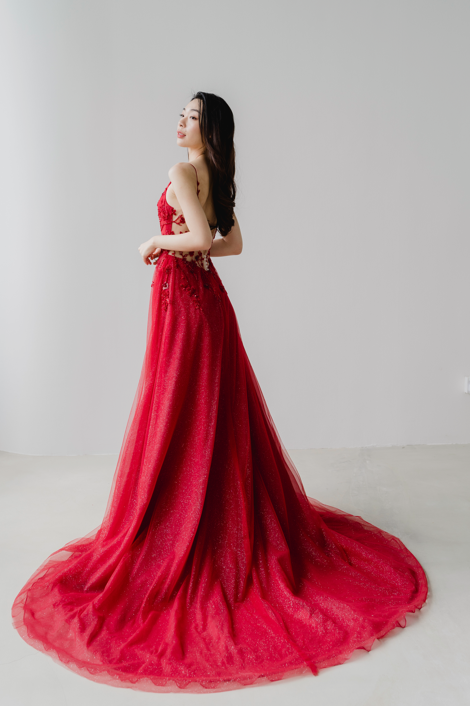 Charlotte bridal evening gown side view with a flowing glitter tulle skirt