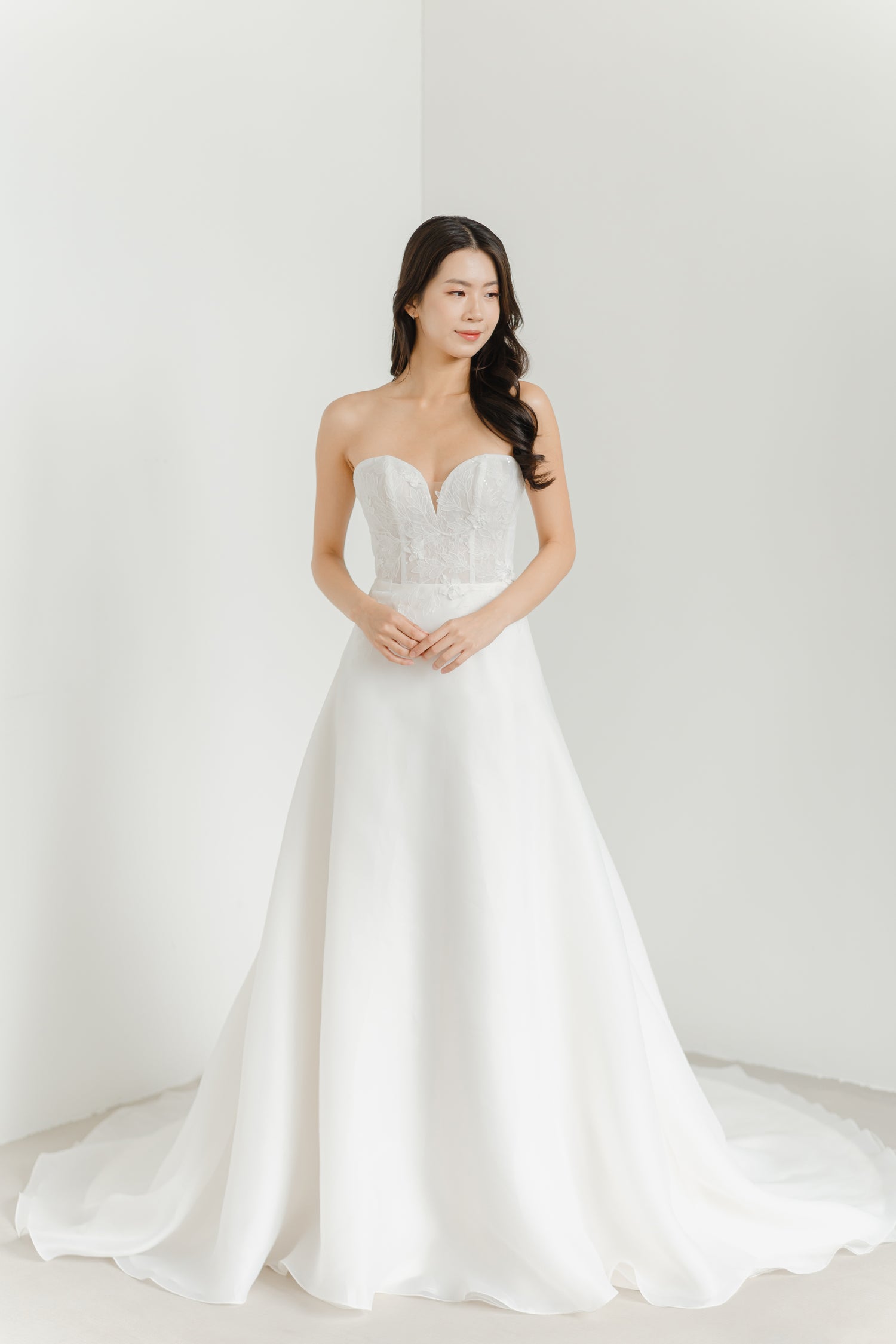 Cherie wedding dress featuring intricate floral appliqués on the lace bodice