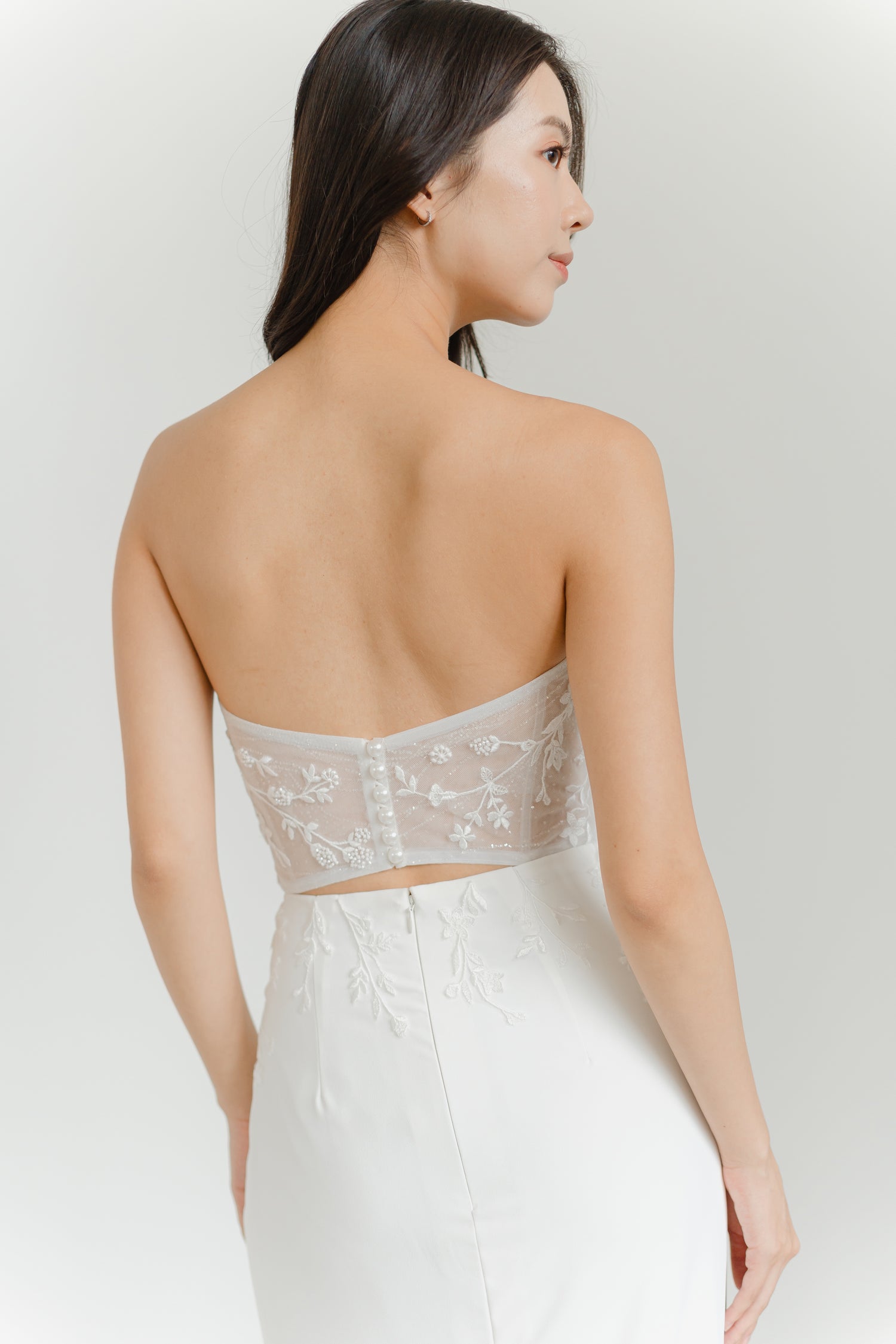 Close-up of Cleo bridal gown showcasing the striking back cutout