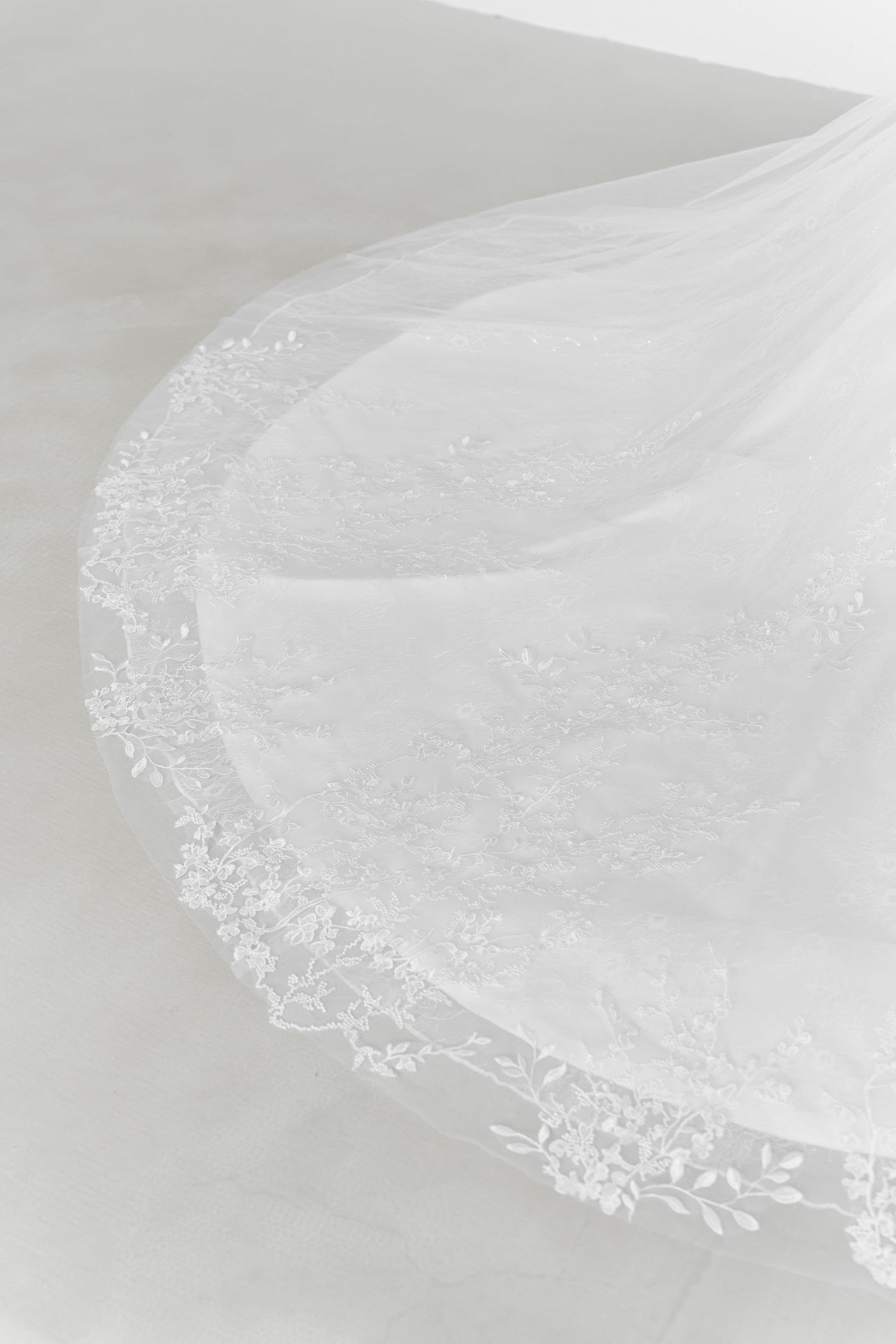 Close-up of Delfina wedding dress highlighting the intricate lace craftsmanship