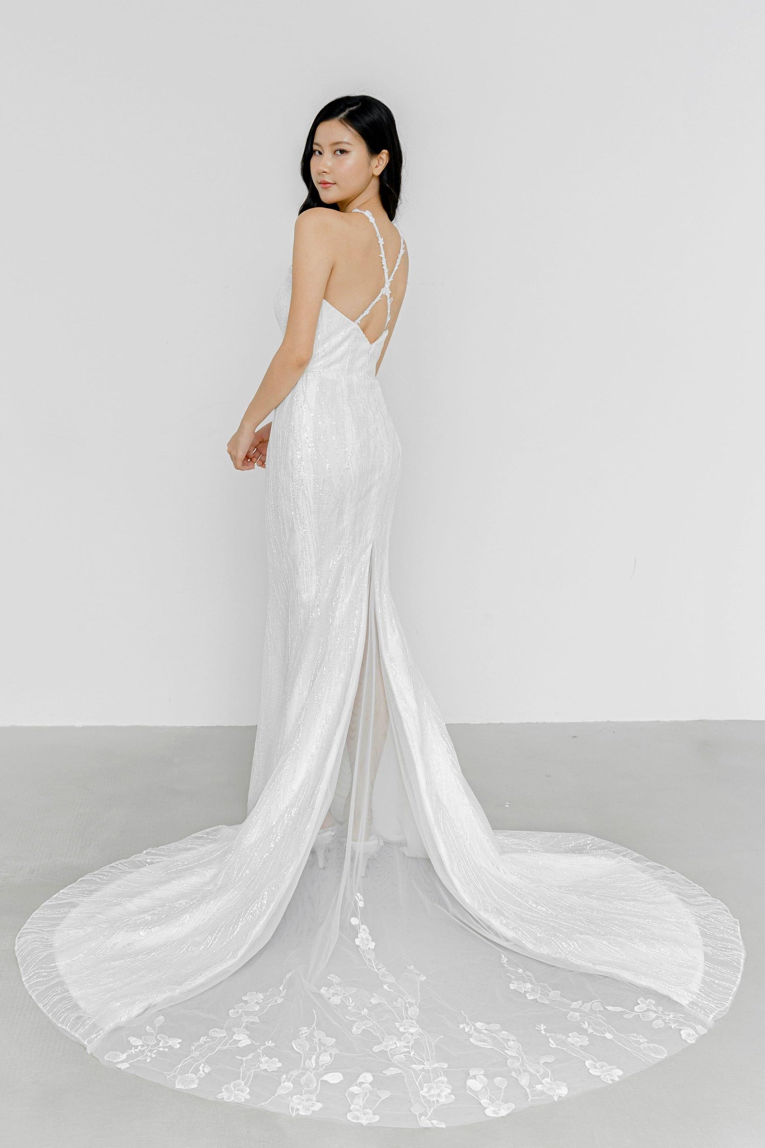 Dinna wedding gown train showcasing the delicate floral lace peekaboo design