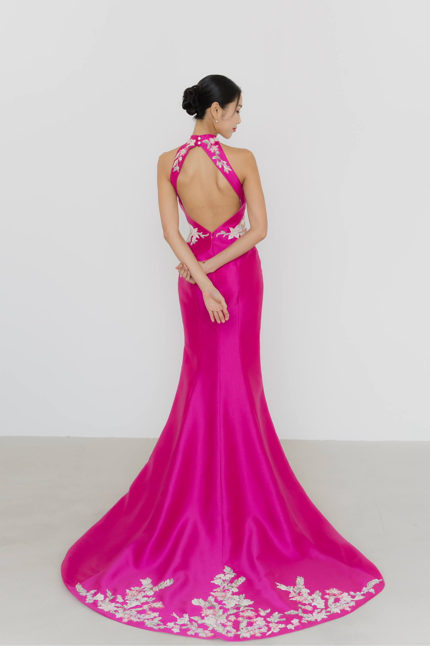 Dionne bridal cheongsam back view with an elegant flowing silhouette