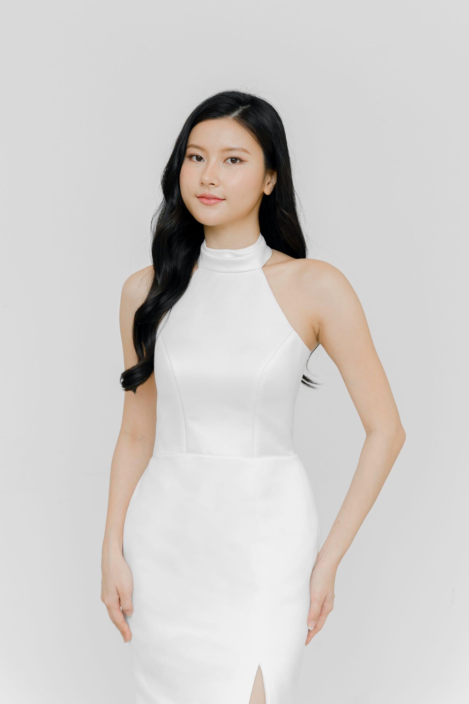 Eberlyn bridal gown front view with a halter neckline and sleek satin silhouette