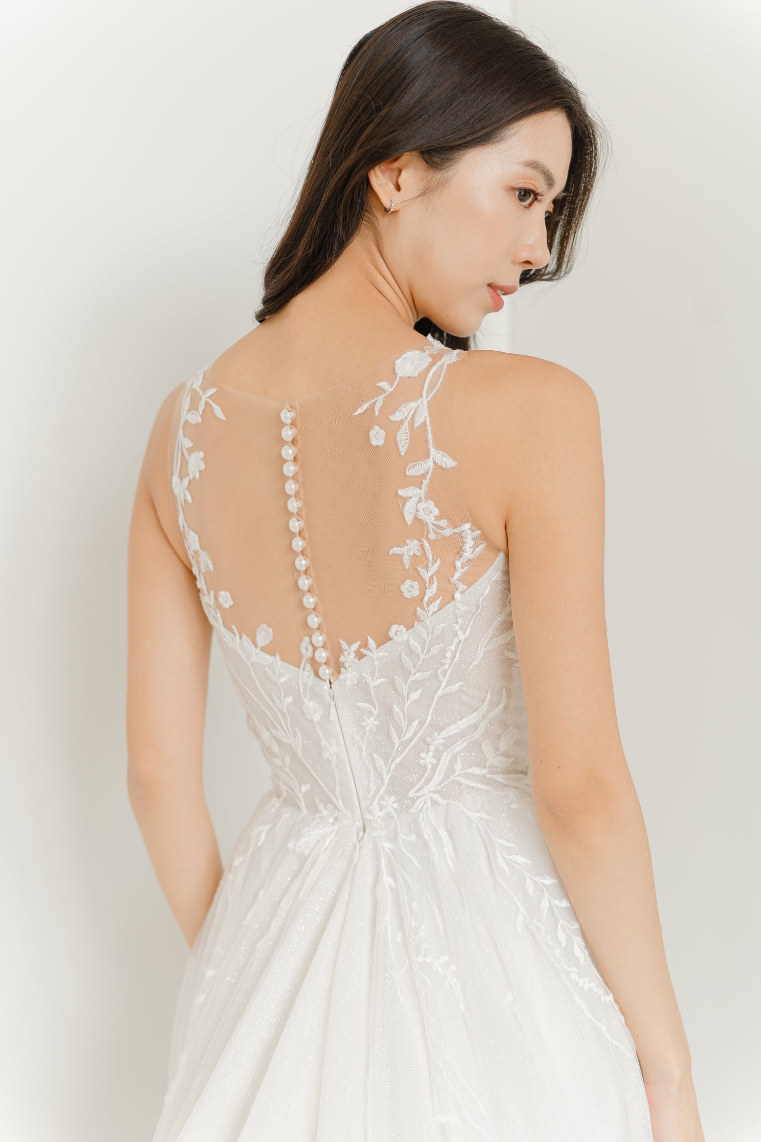 Close-up of Elisha wedding gown highlighting the classic pearl button back