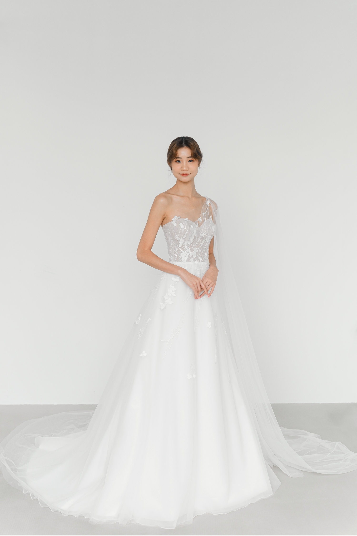 Emelia wedding gown front view with a one-shoulder neckline