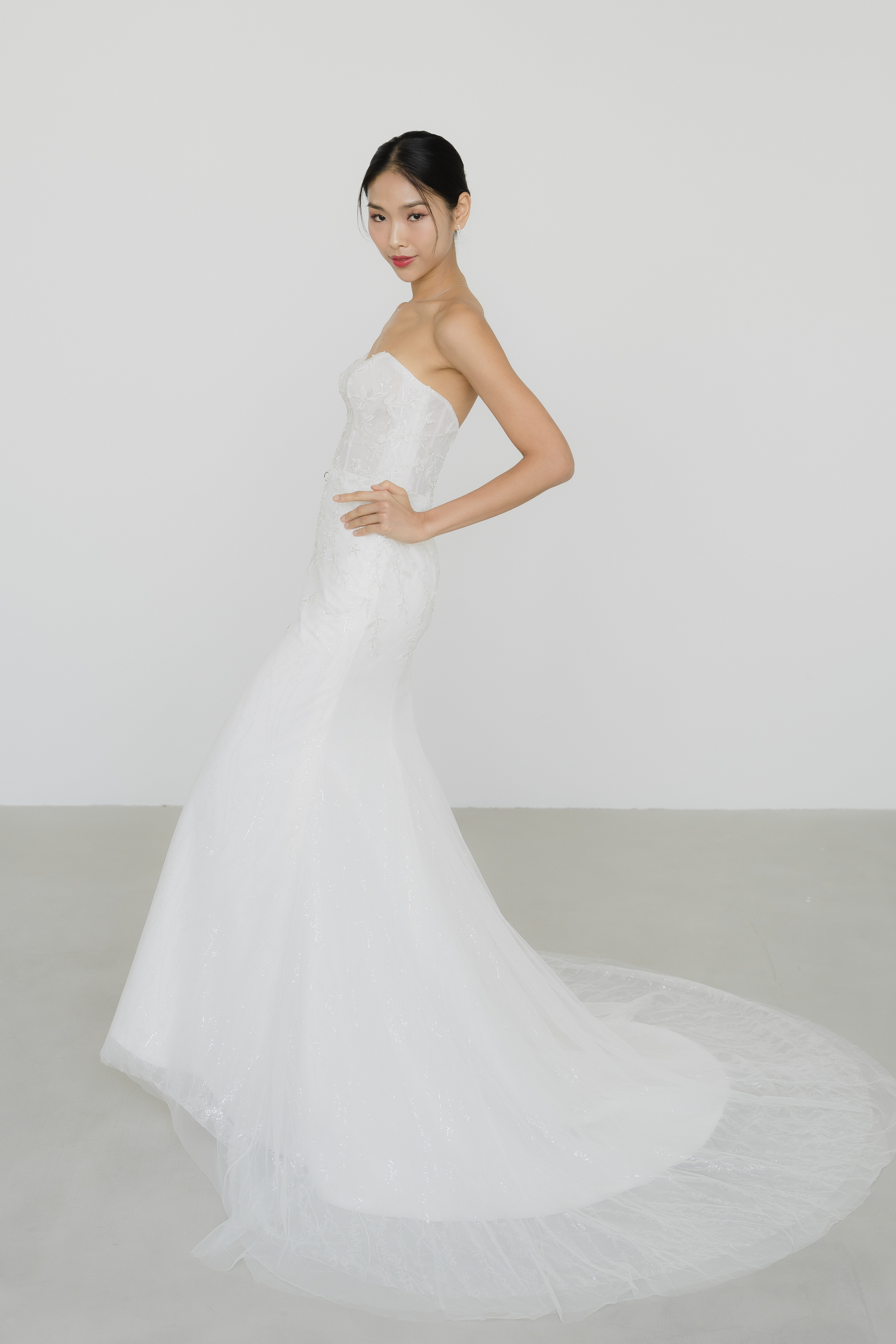 Esme wedding gown side view showcasing the shimmering sequinned fabric