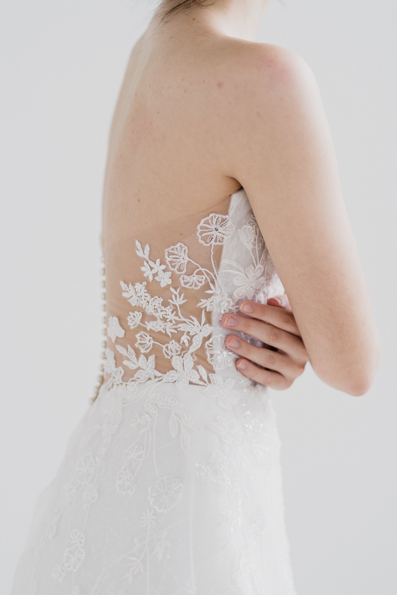 Genith bridal gown side view with an A-line silhouette