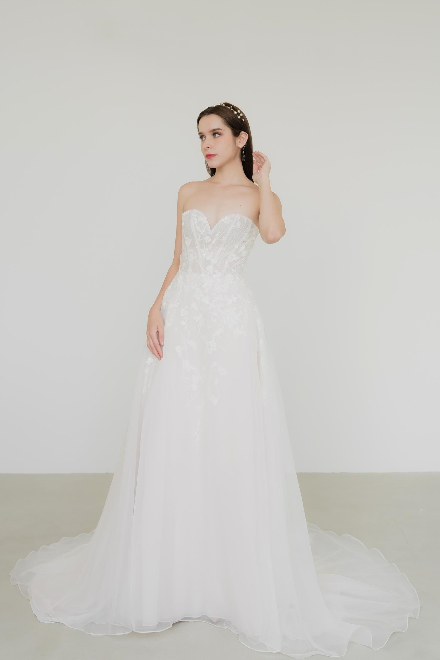 Gladys bridal gown featuring delicate lace detailing and flowing white organza