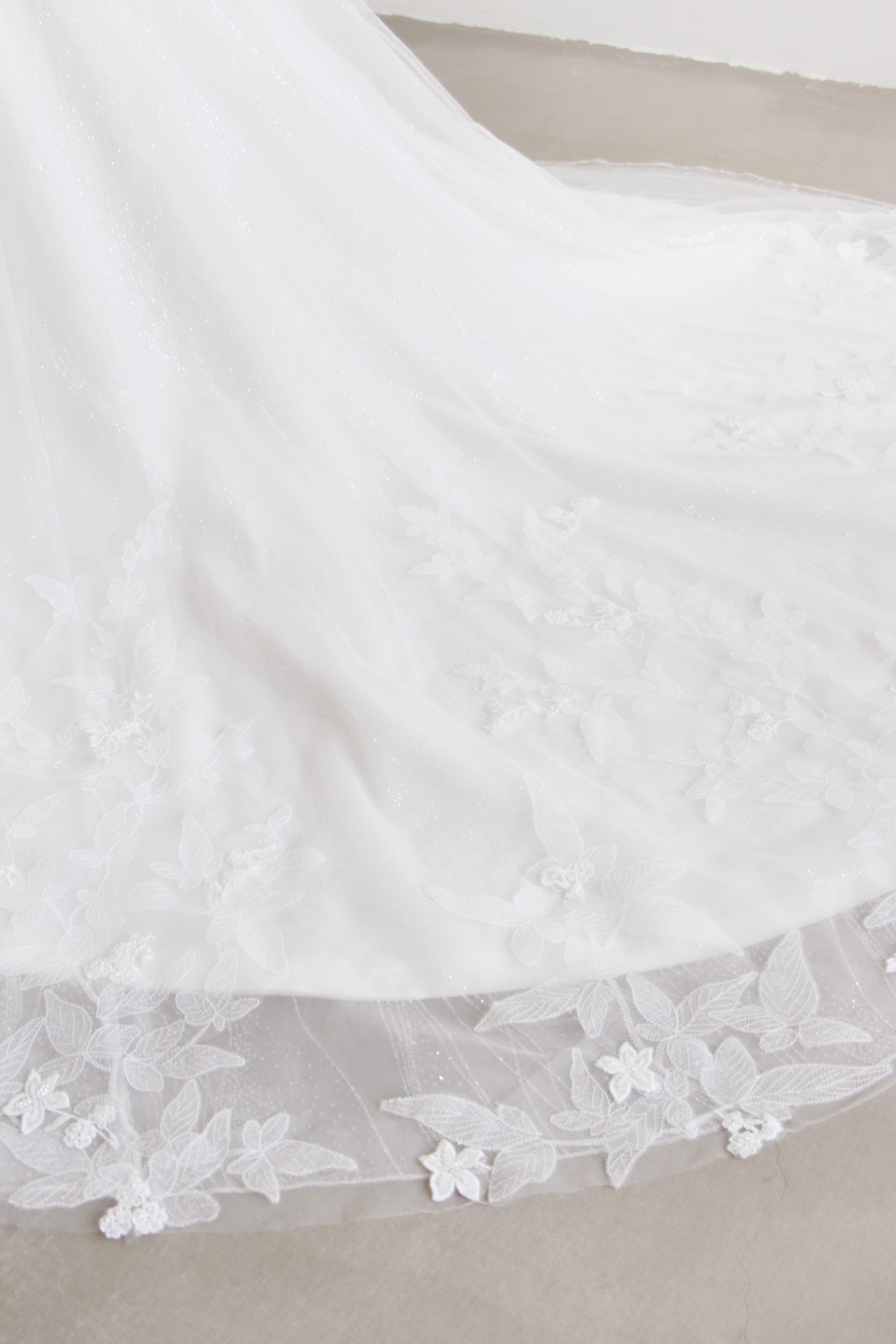 Hallie wedding dress featuring an elegant lace train