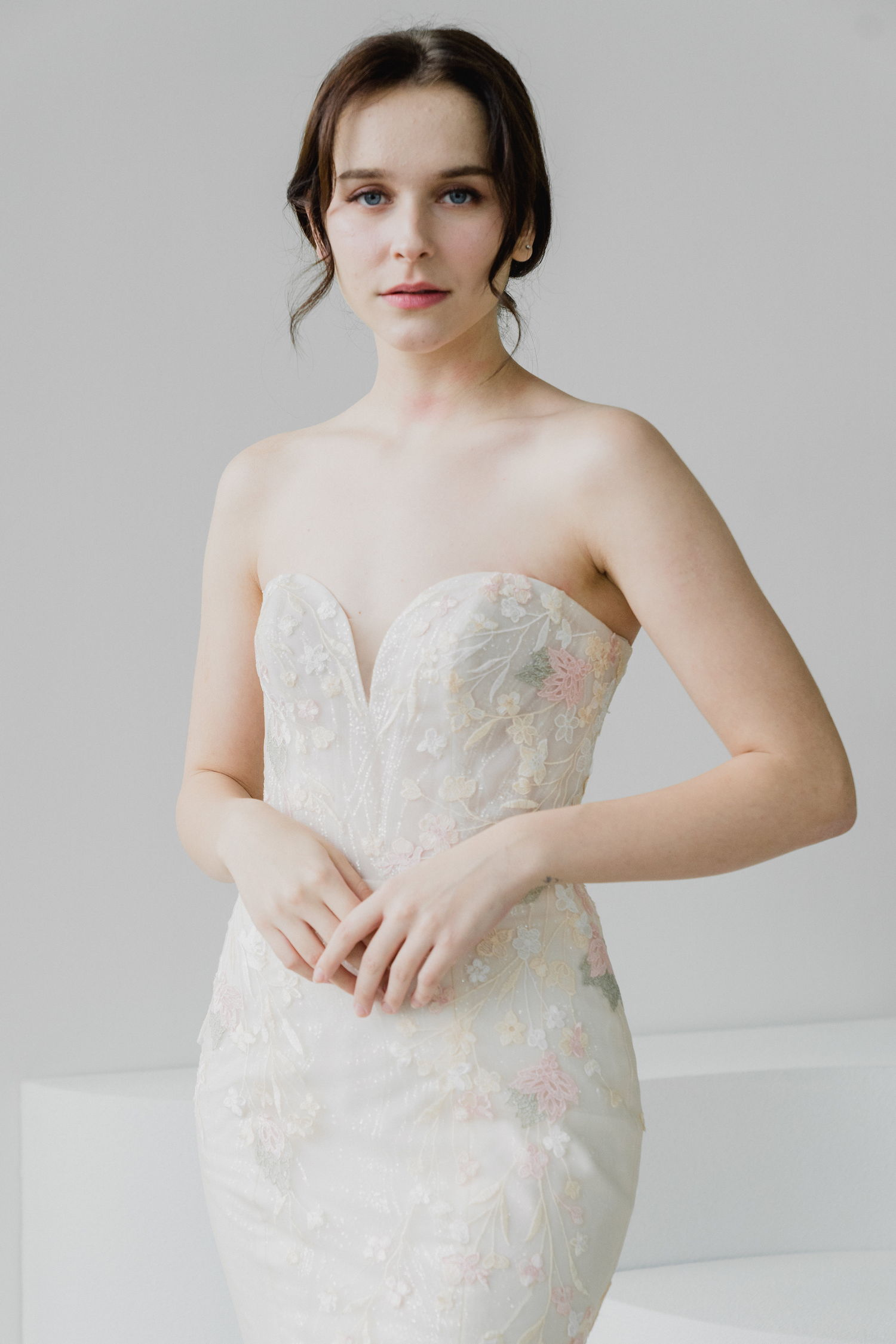 Hana bridal cheongsam featuring blush glitter tulle and pastel floral embroidery
