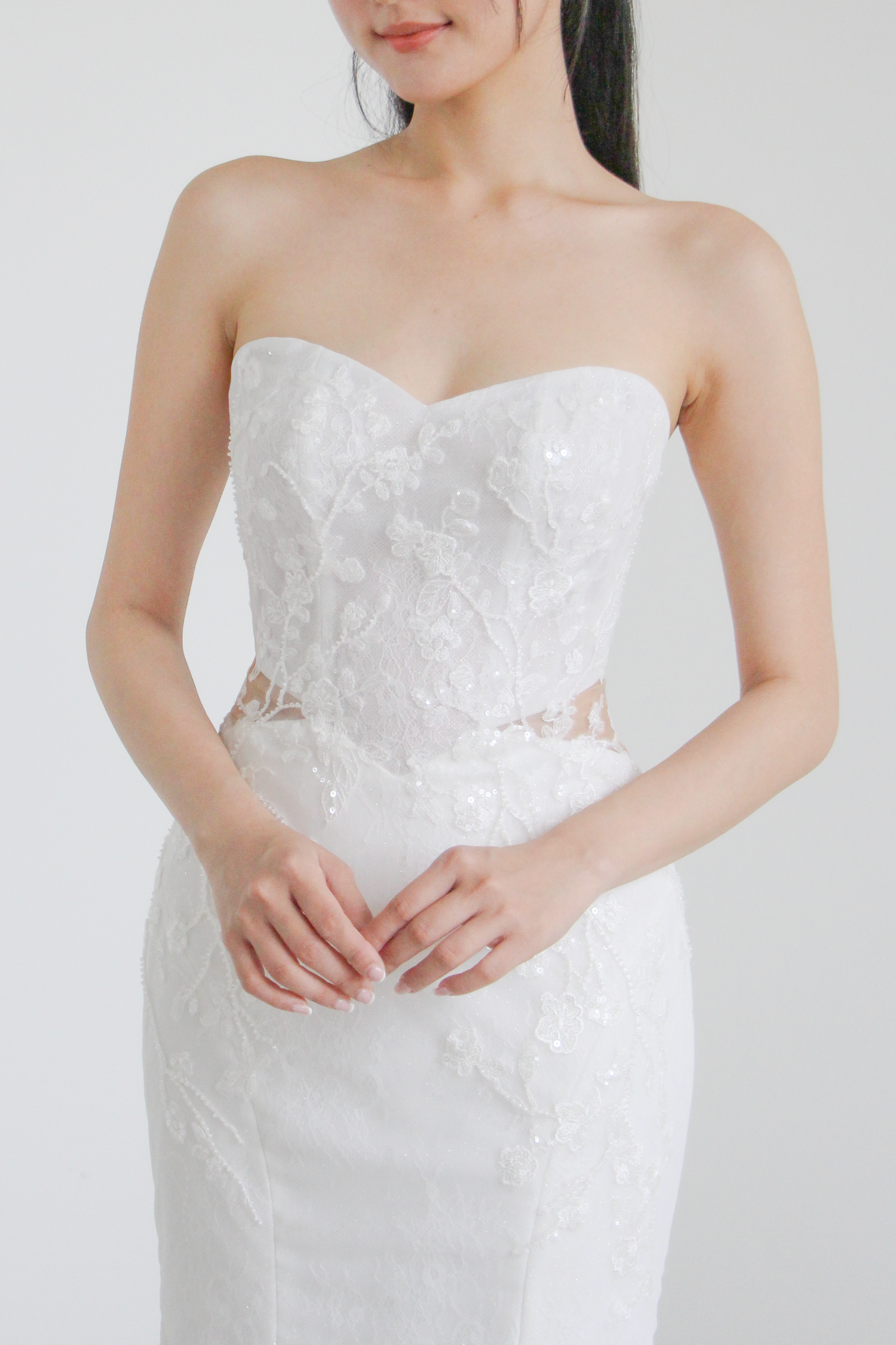 Close-up of Isadora bridal gown showcasing the illusion side waist cut-outs