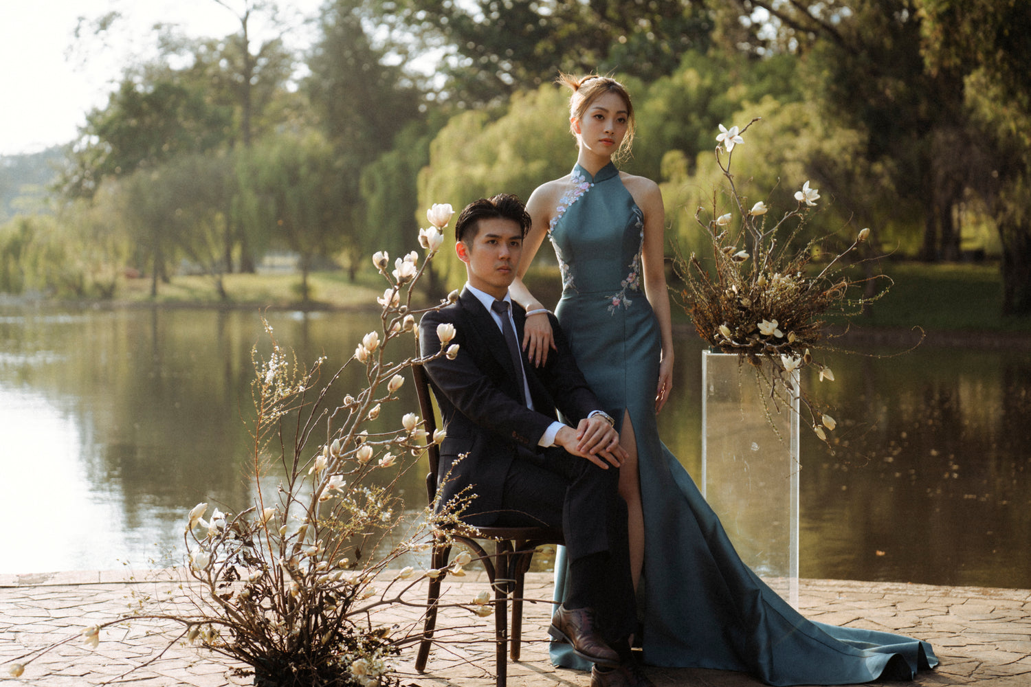 Jade teal modern wedding cheongsam with a halter neckline and floral lace detailing