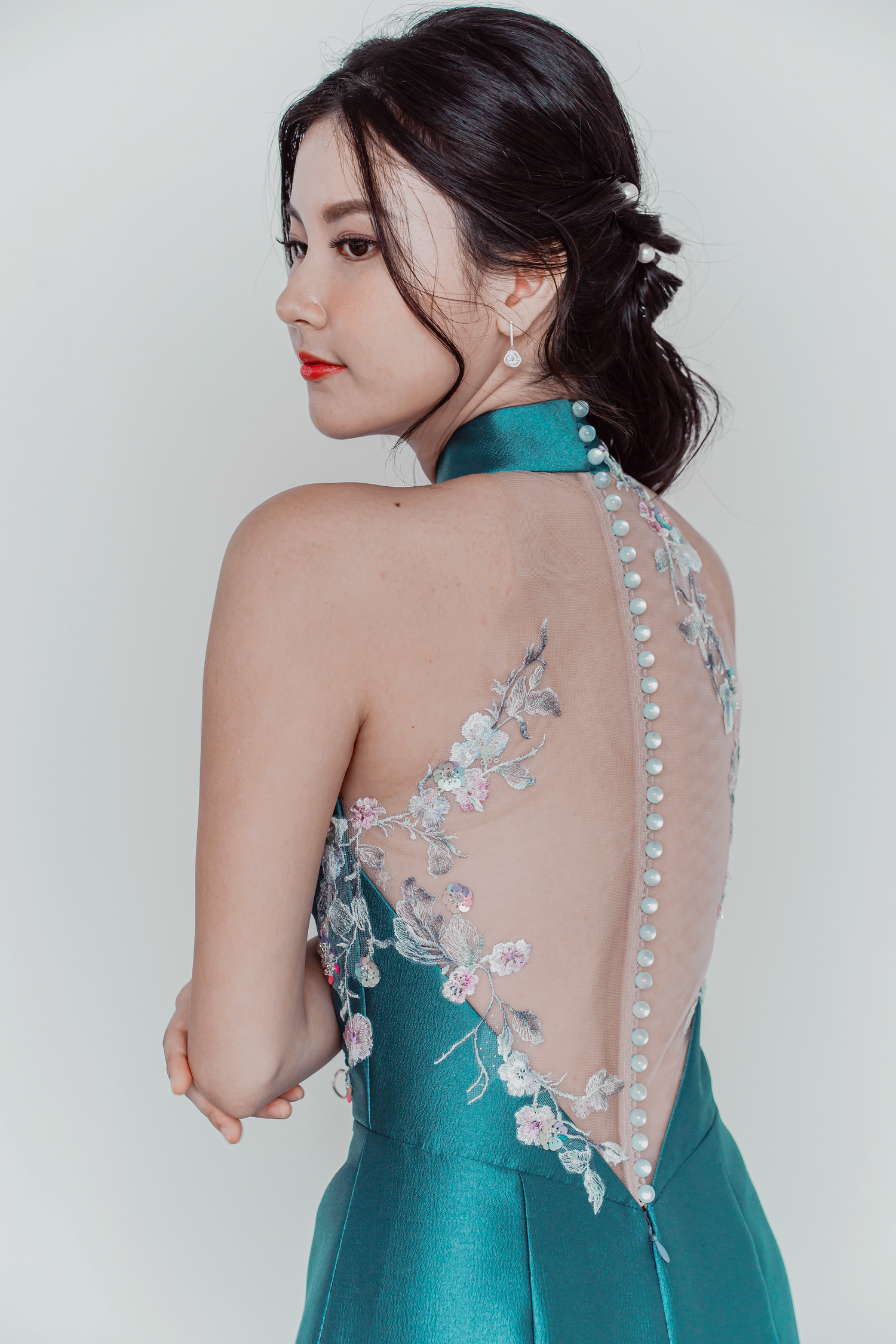 Jade wedding cheongsam side view with an illusion lace side panel