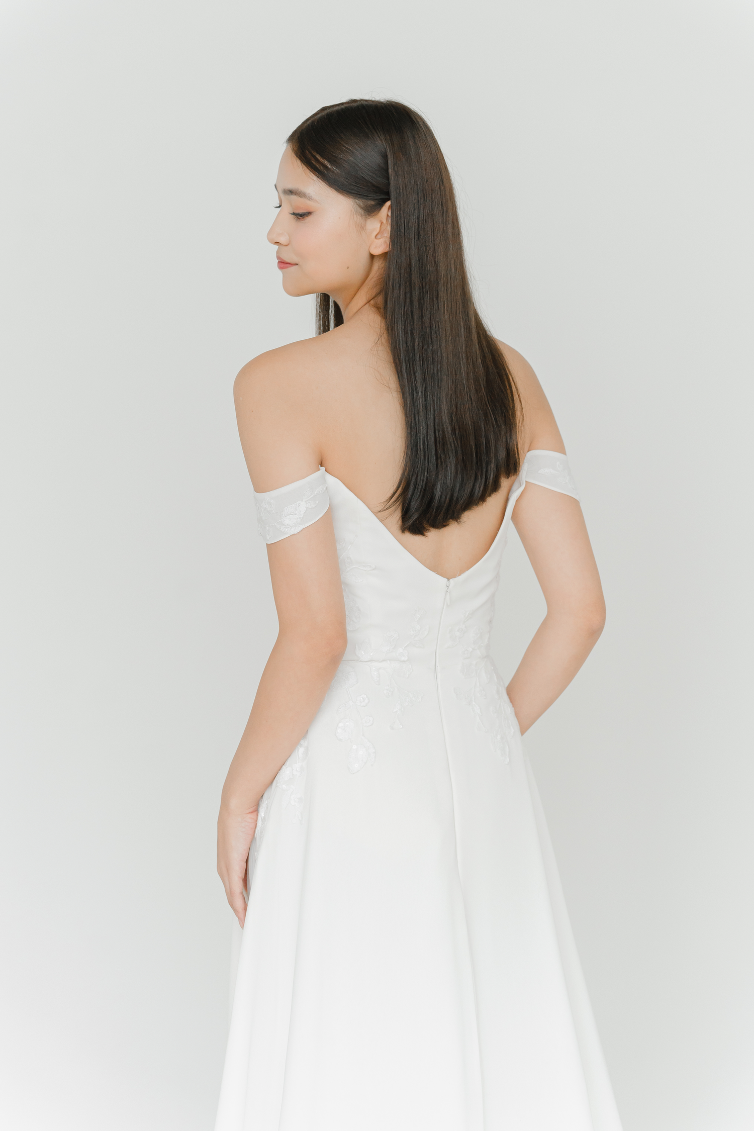 Close-up of Jolie wedding dress featuring the off-shoulder neckline