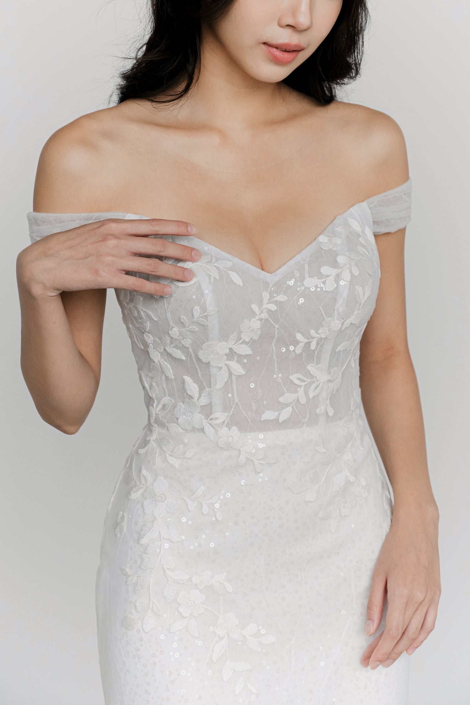 Close-up of Josie bridal gown showcasing the romantic off-shoulder straps