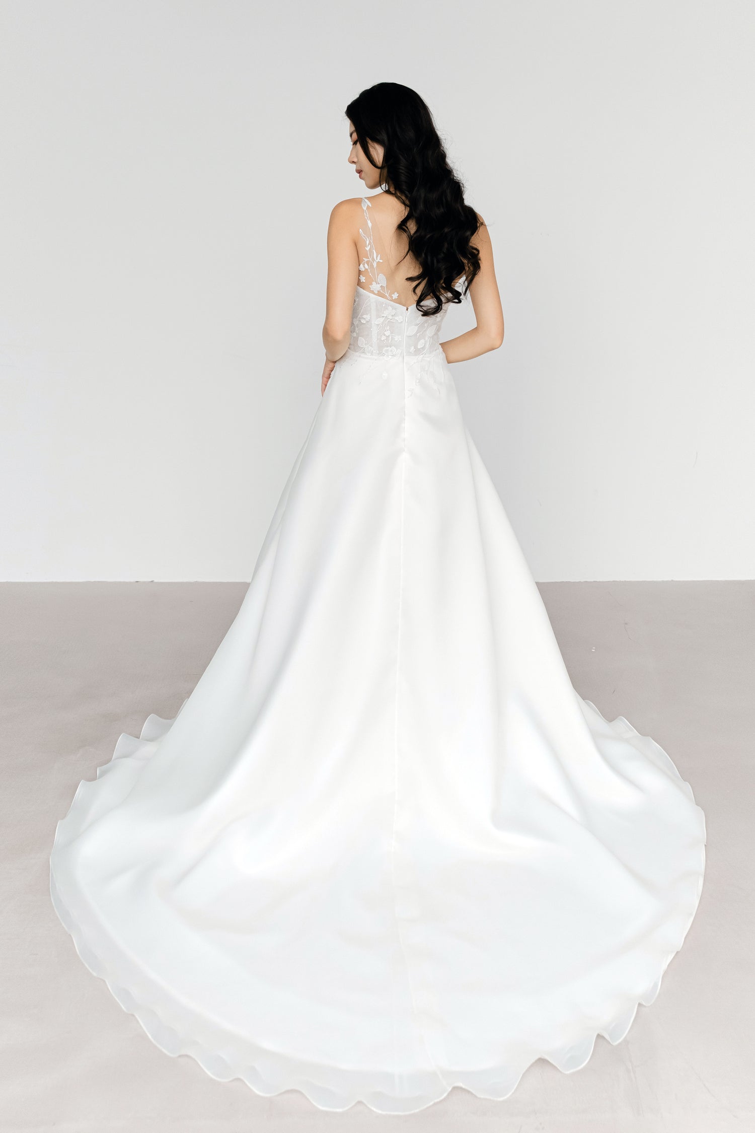 Karla bridal gown train showcasing the airy organza skirt and graceful flowing train