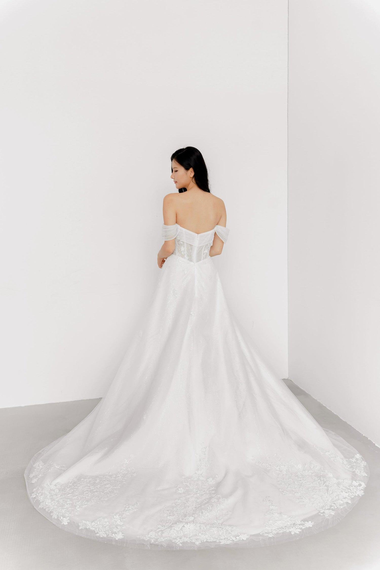 Kimber bridal gown back view with a graceful flowing silhouette