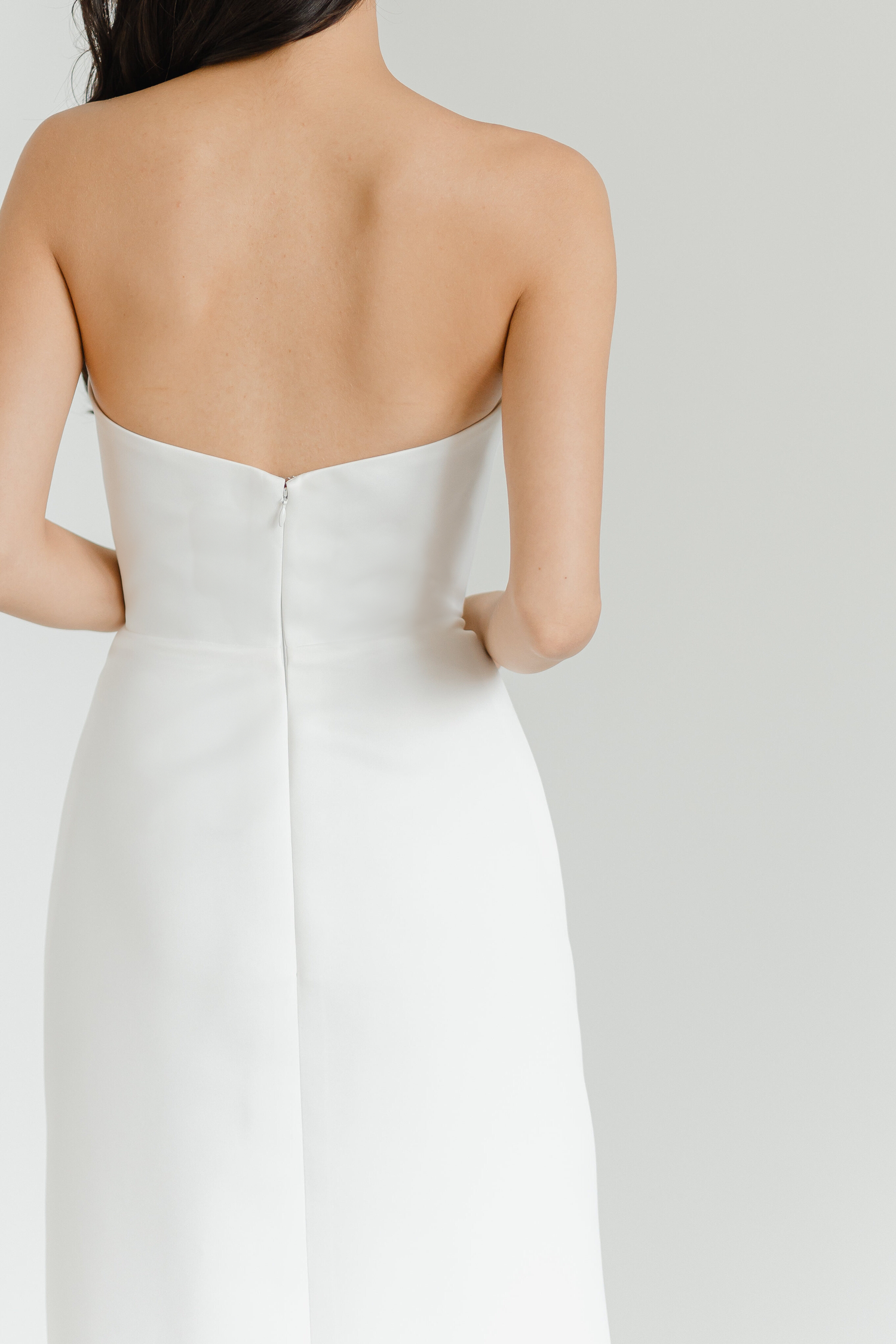 Close-up of Kirby wedding gown highlighting the luxurious crepe fabric