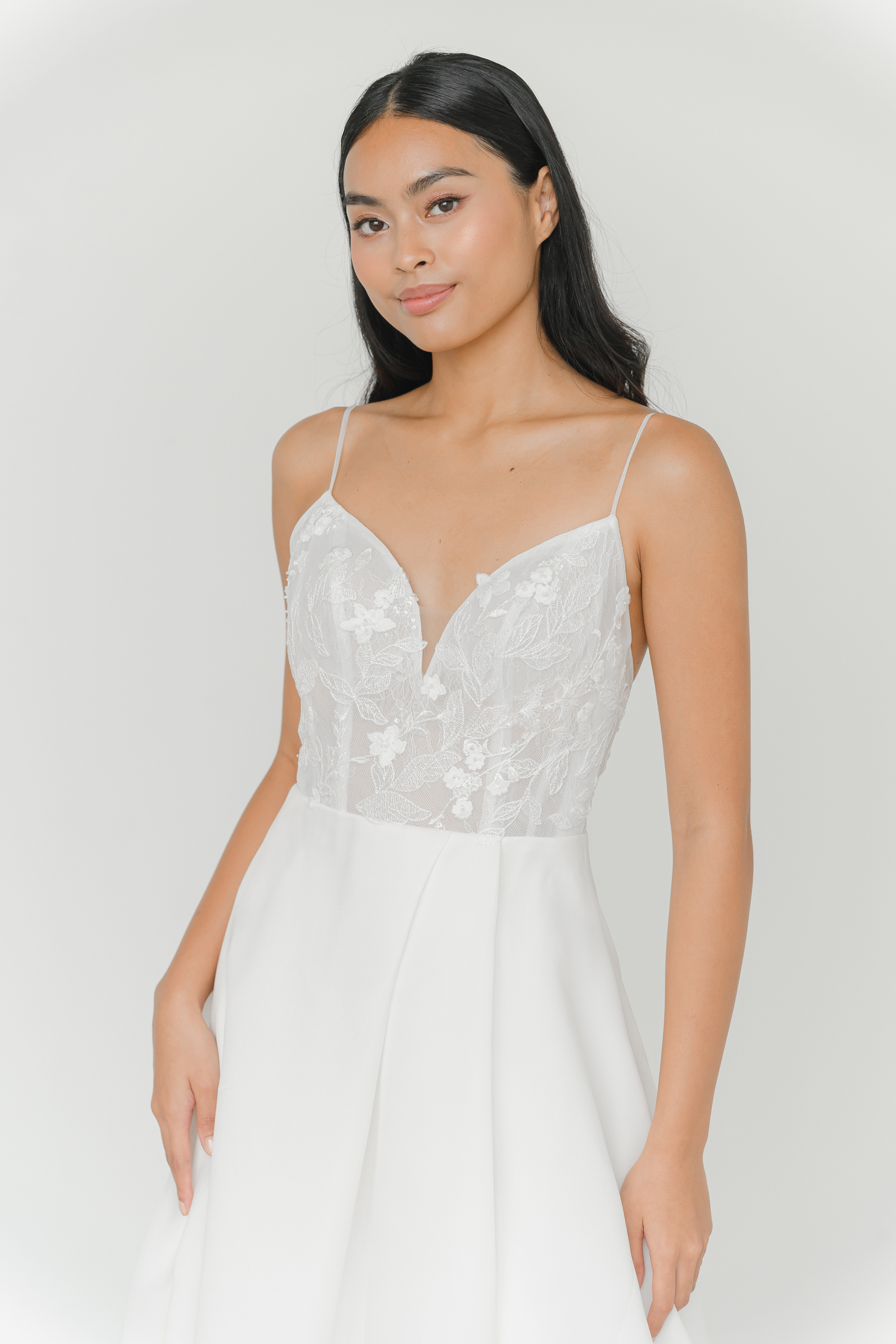 Layla wedding dress front view with a lace bodice and V-neckline