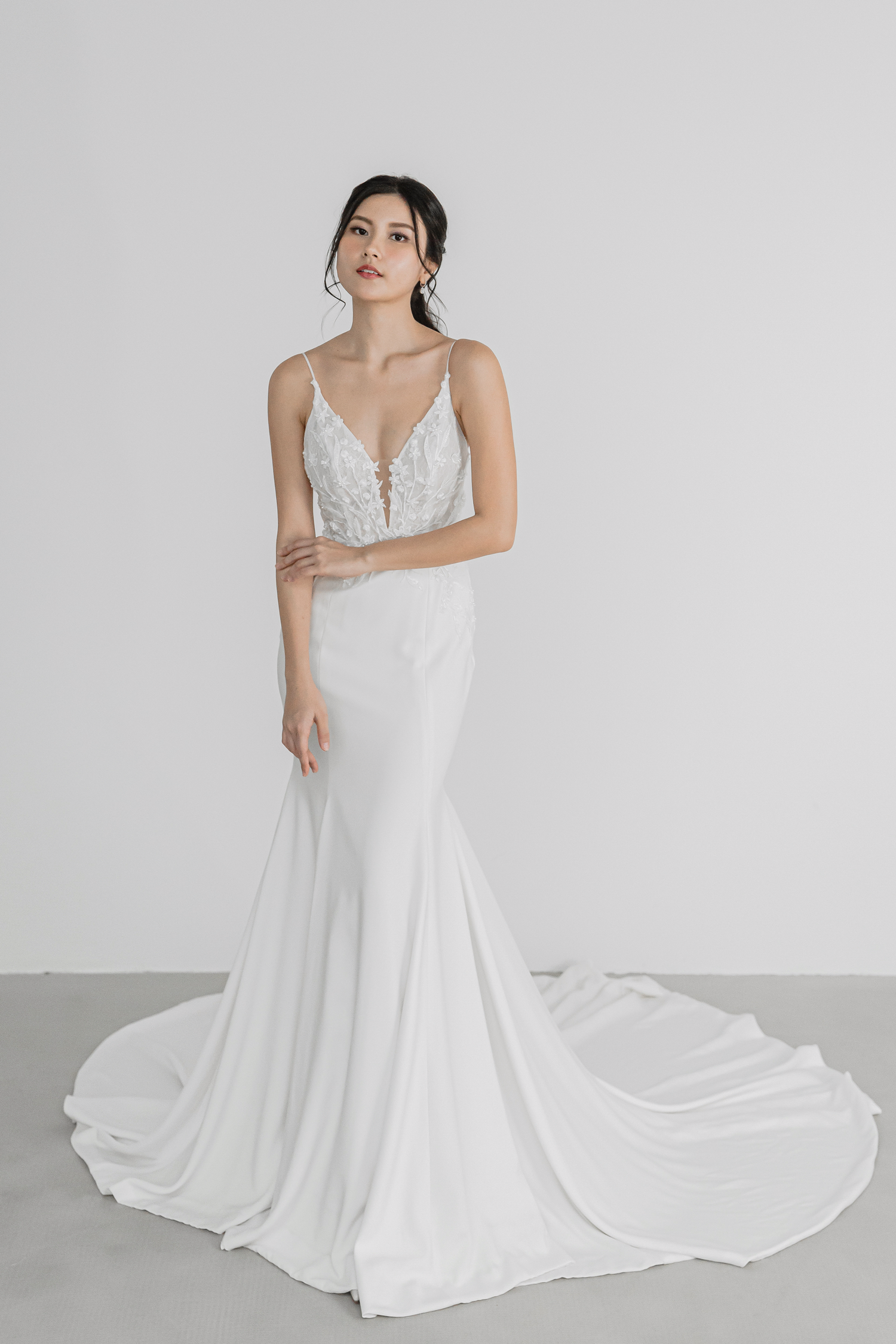 Liyana wedding gown featuring a beaded floral lace bodice and crepe mermaid skirt