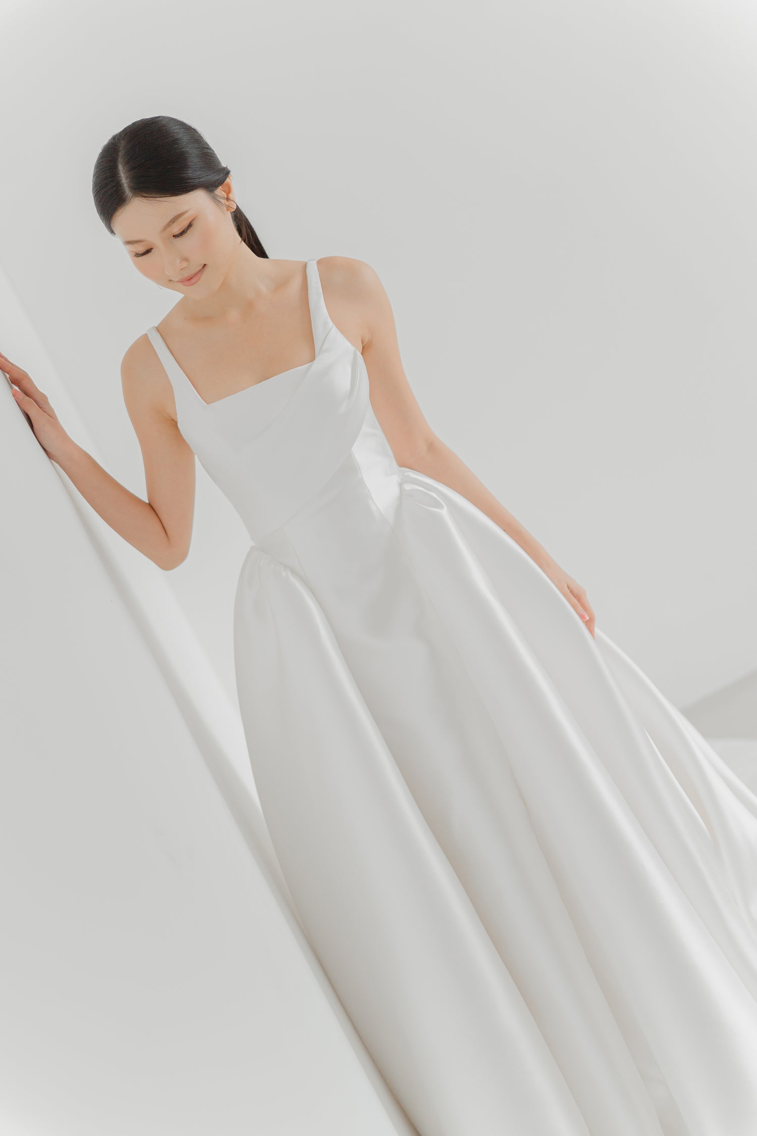 Maeve wedding dress front view with a square neckline and structured Mikado ballgown silhouette