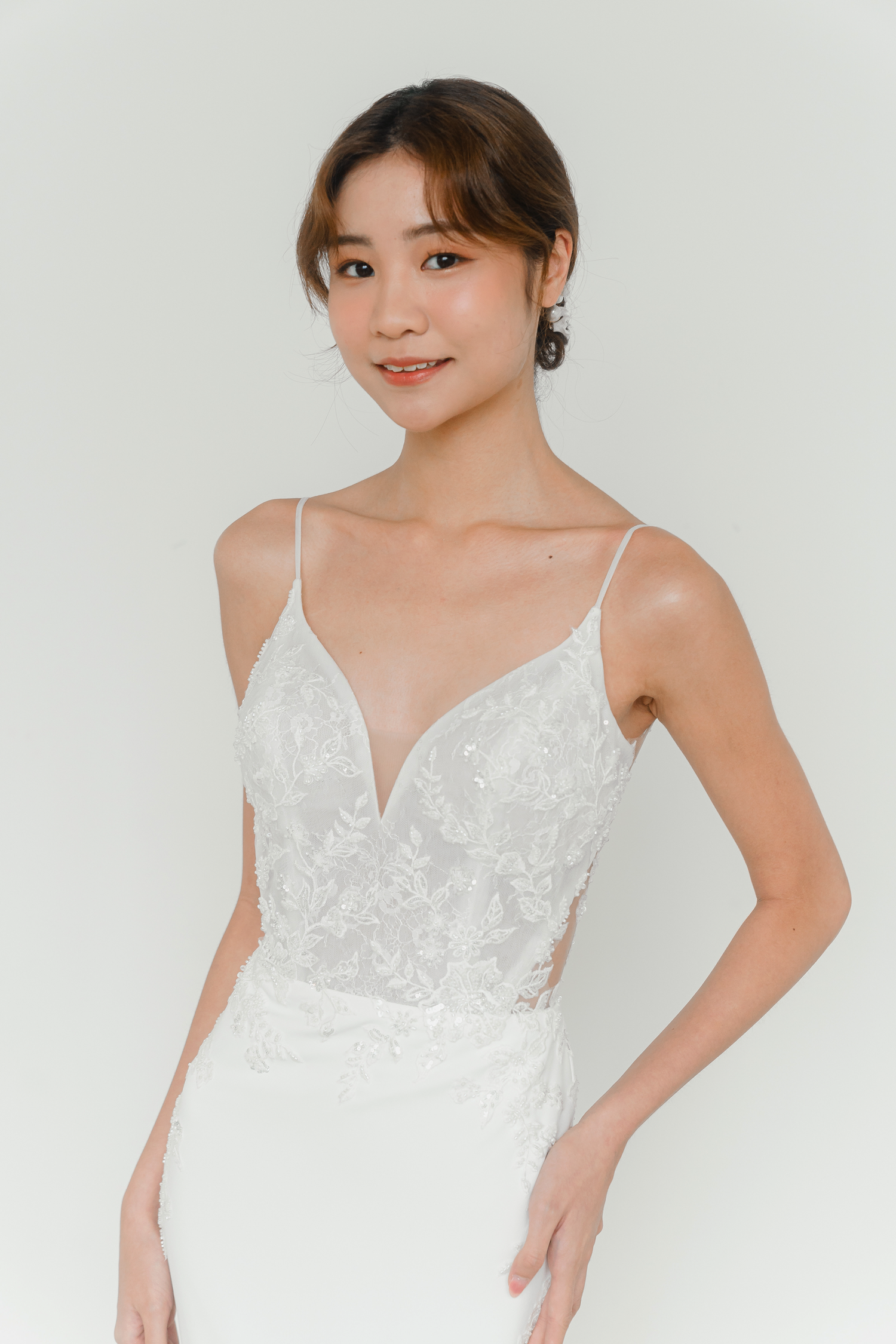 Close-up of Melanie bridal gown with soft beaded lace detailing