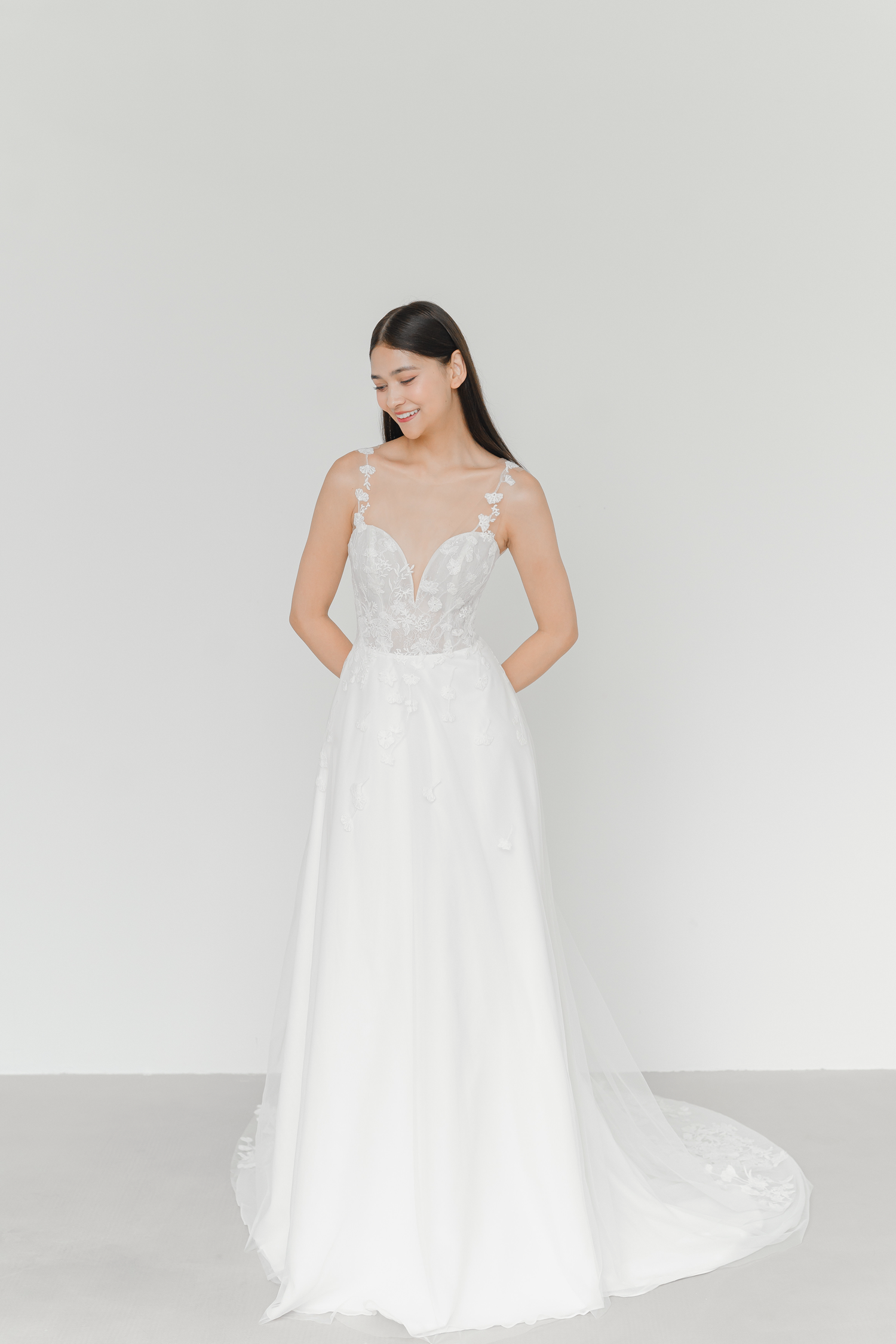 Mikaela wedding dress front view with delicate floral lace vines and a soft A-line silhouette