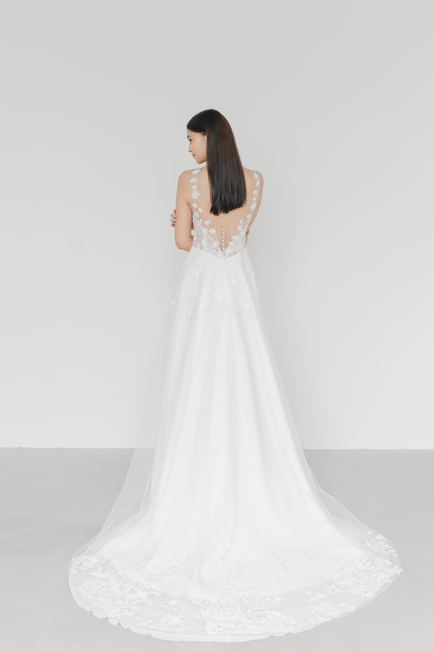 Mikaela wedding gown train showcasing delicate lace detailing and a flowing silhouette