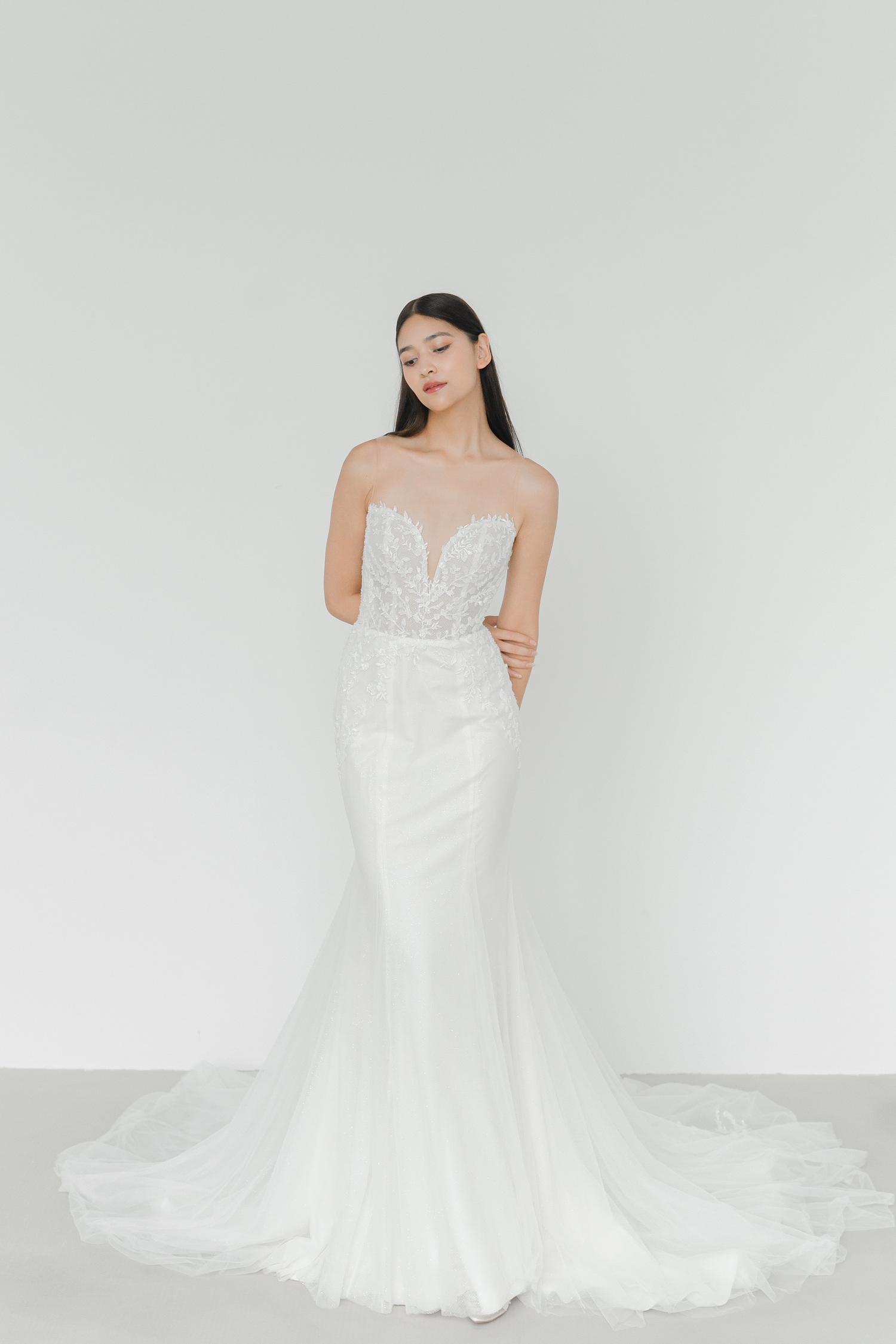 Monica bridal gown front view with intricate beaded lace and a mermaid silhouette
