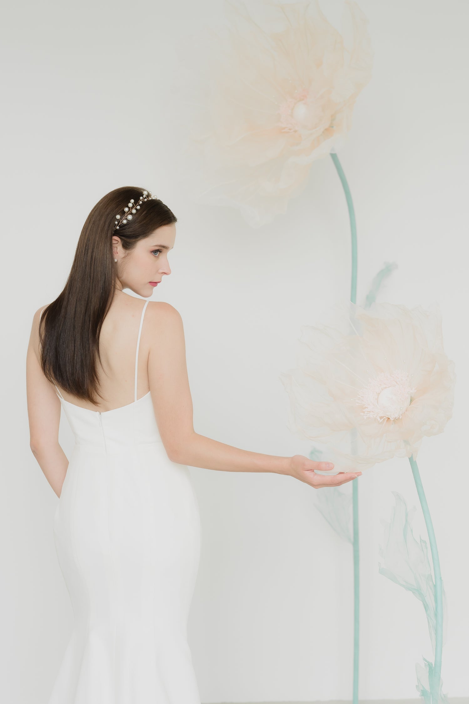 Close-up of Nadia wedding dress highlighting the luxurious crepe fabric and minimalist bodice