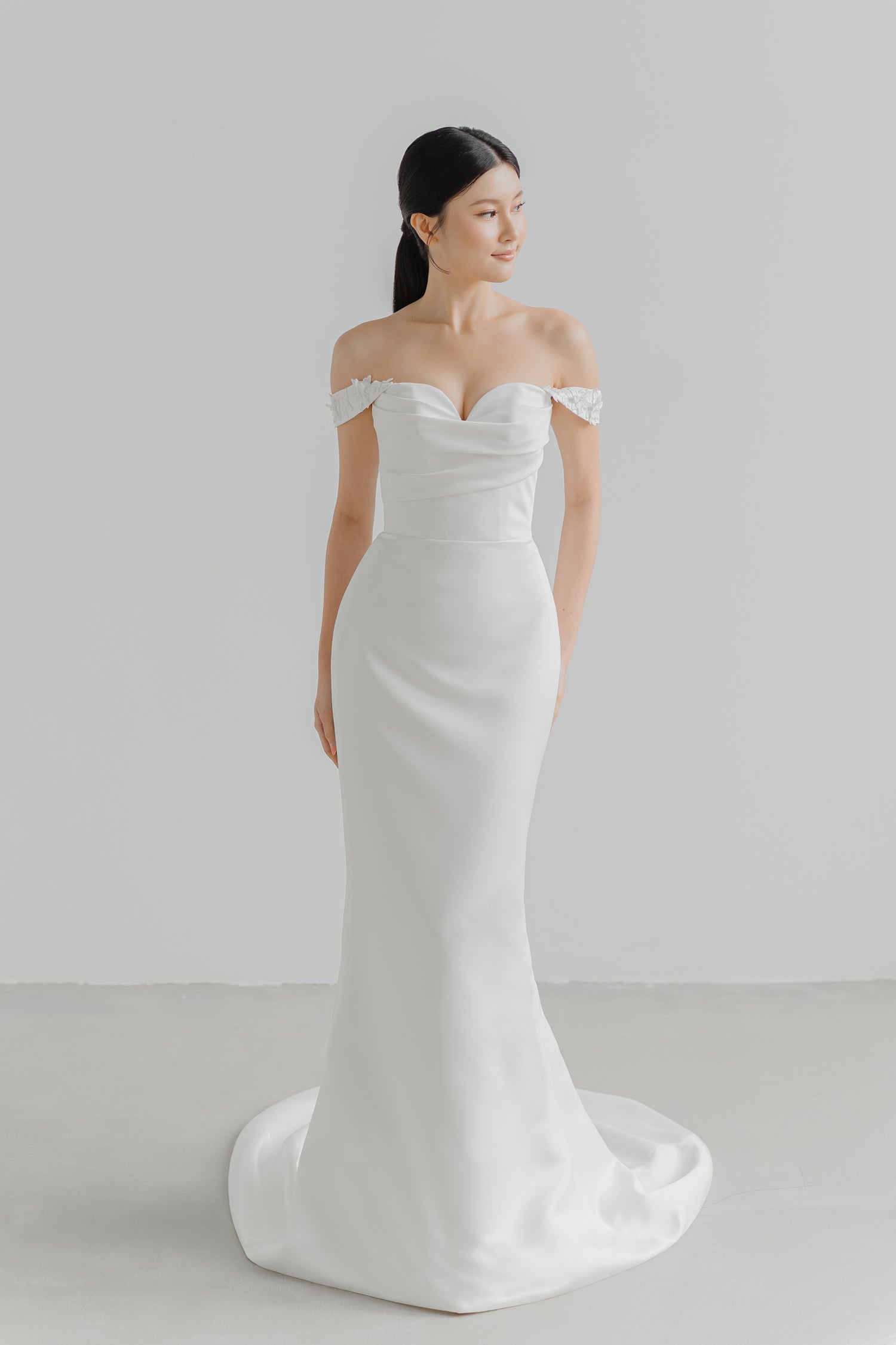 Noelle bridal gown front view with a minimalist silhouette and softly ruched bodice