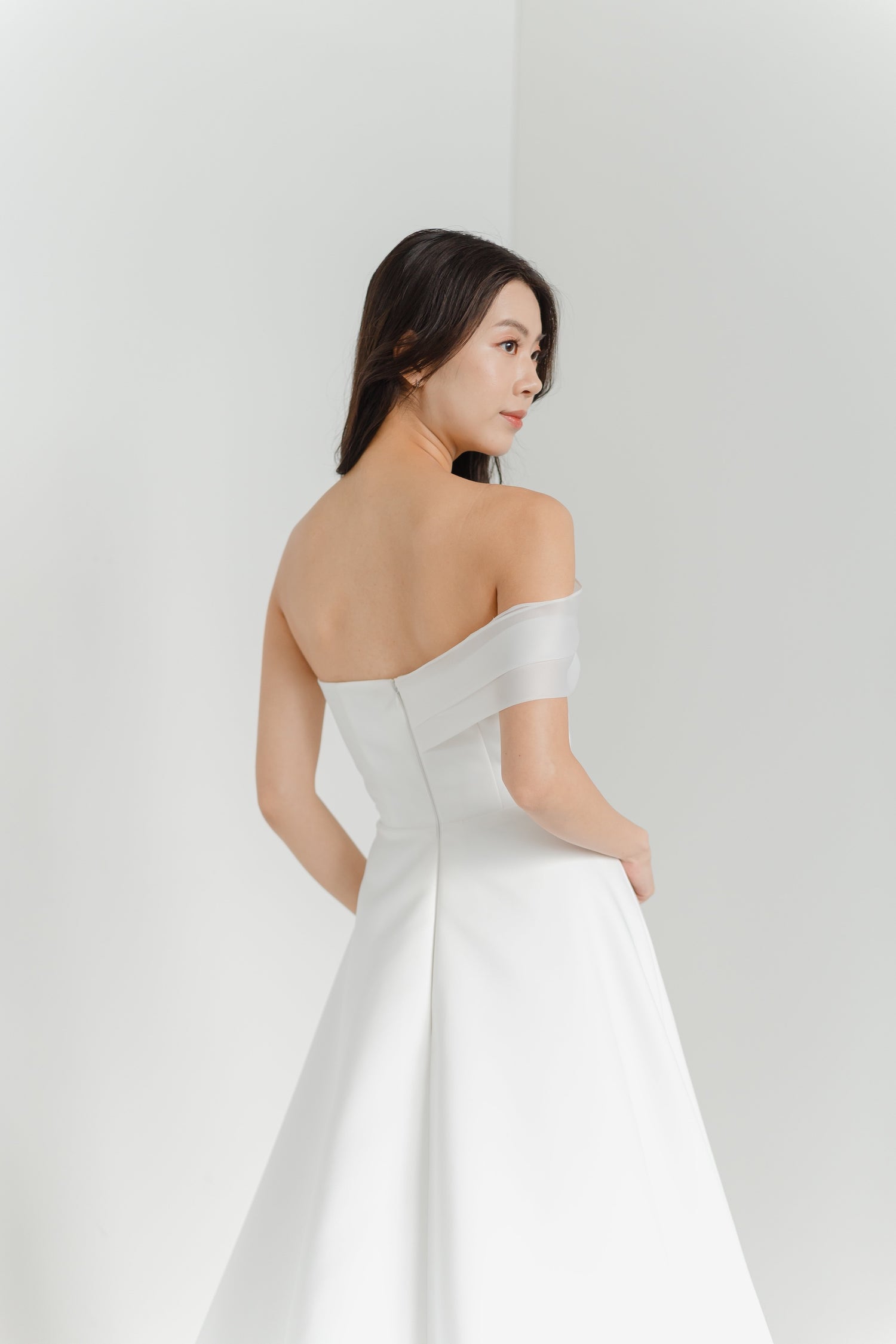 Odette wedding gown side view with a sleek minimalist silhouette