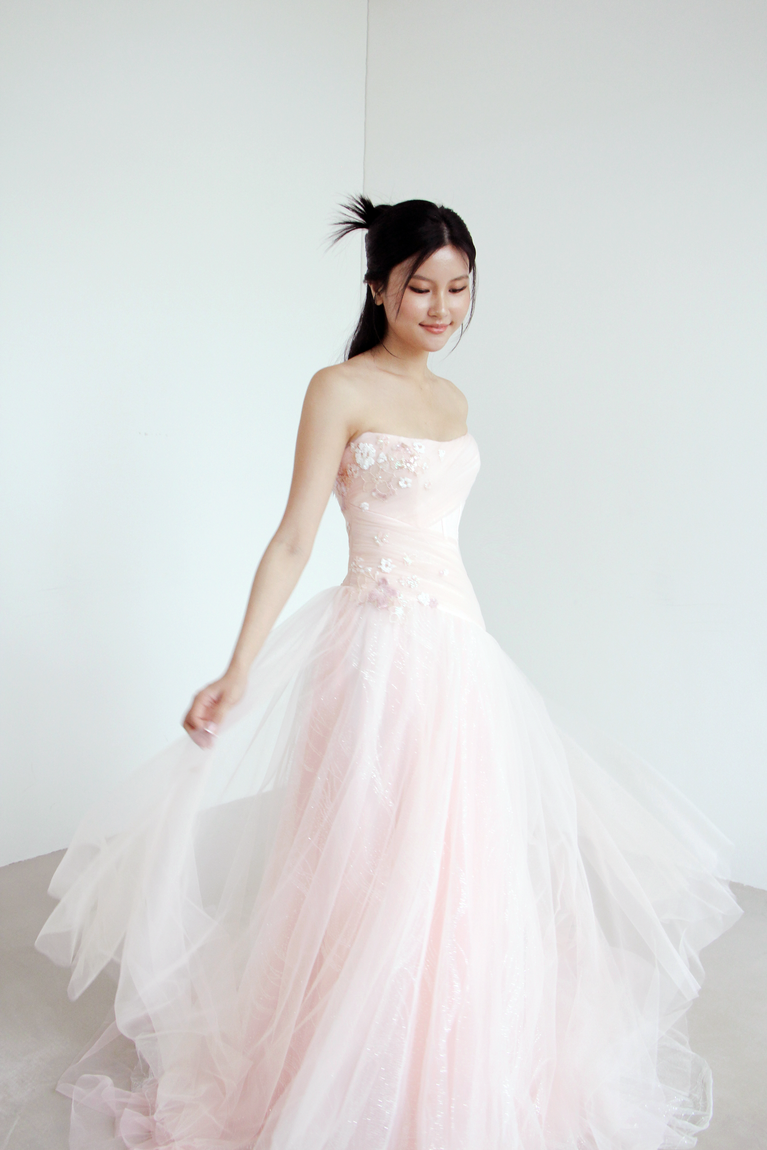 Paisley evening gown front view in blush pink glitter tulle with a sculpted drop waist