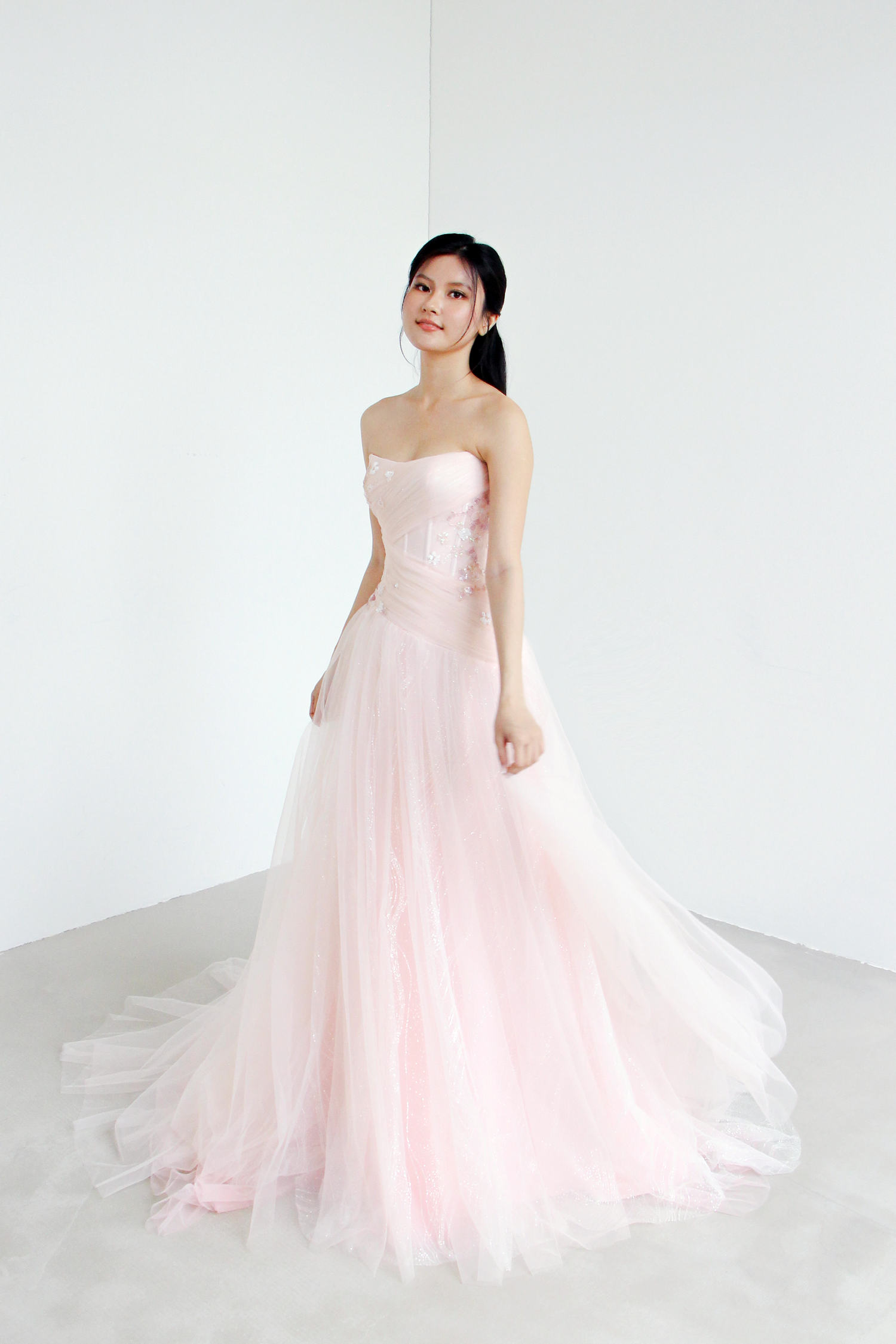 Paisley evening gown side view showcasing the softly flared silhouette and layered tulle
