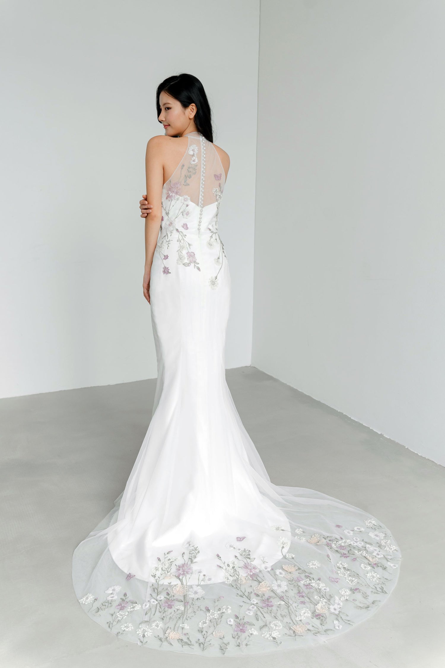 Penny wedding cheongsam train showcasing the delicate pastel lace detailing and flowing train