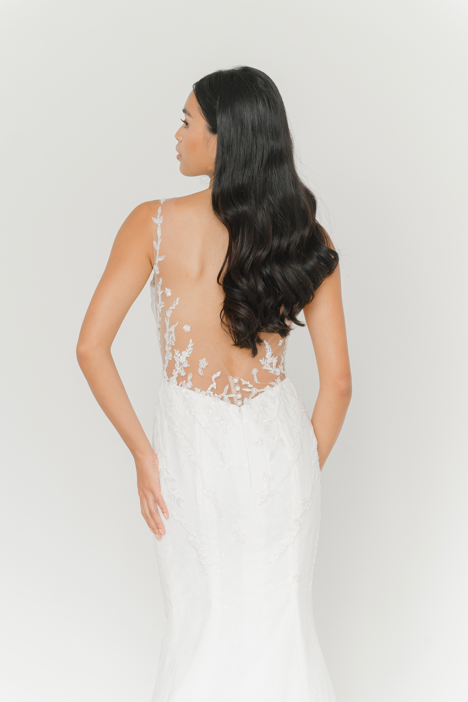 Rhea wedding dress back view with a dramatic low-back design