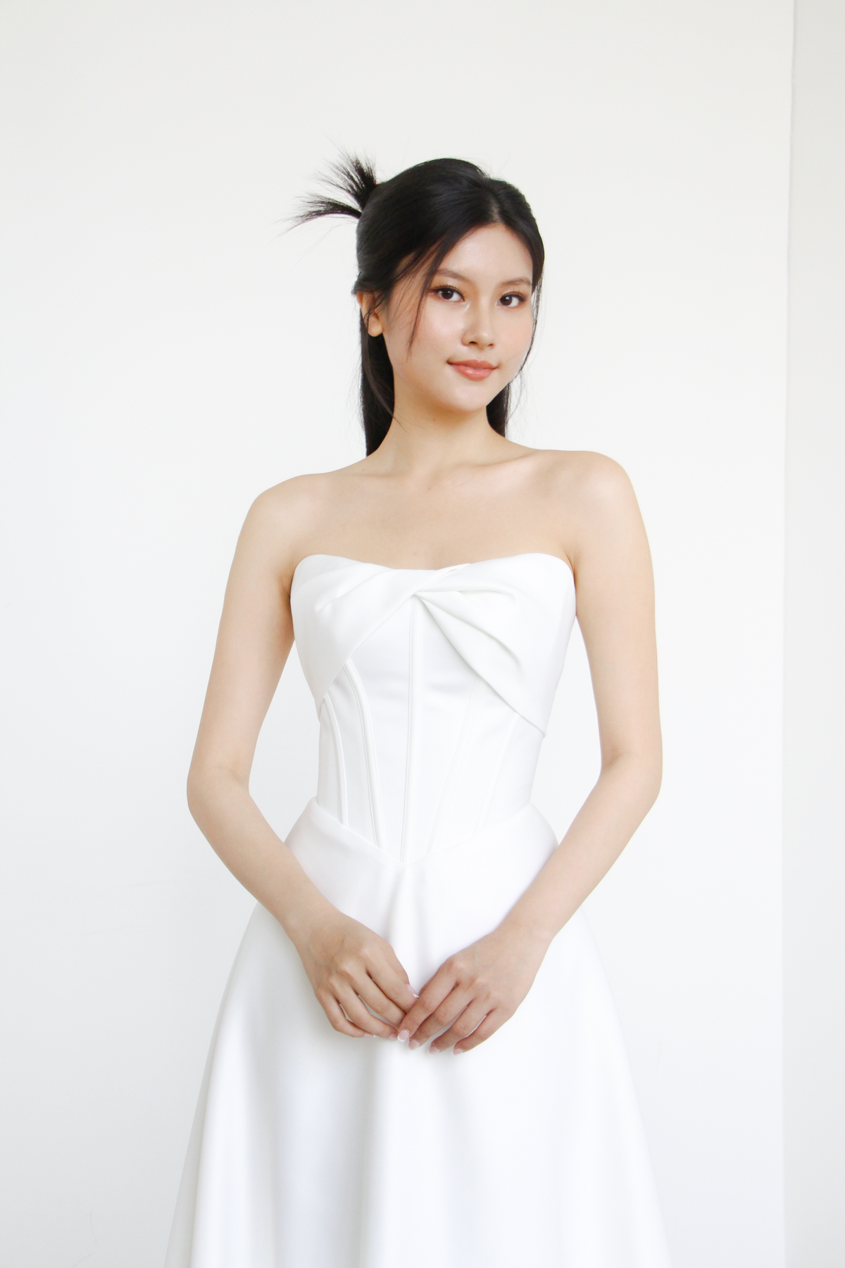 Rosalie bridal gown featuring an elegant twist detail and structured corset bodice