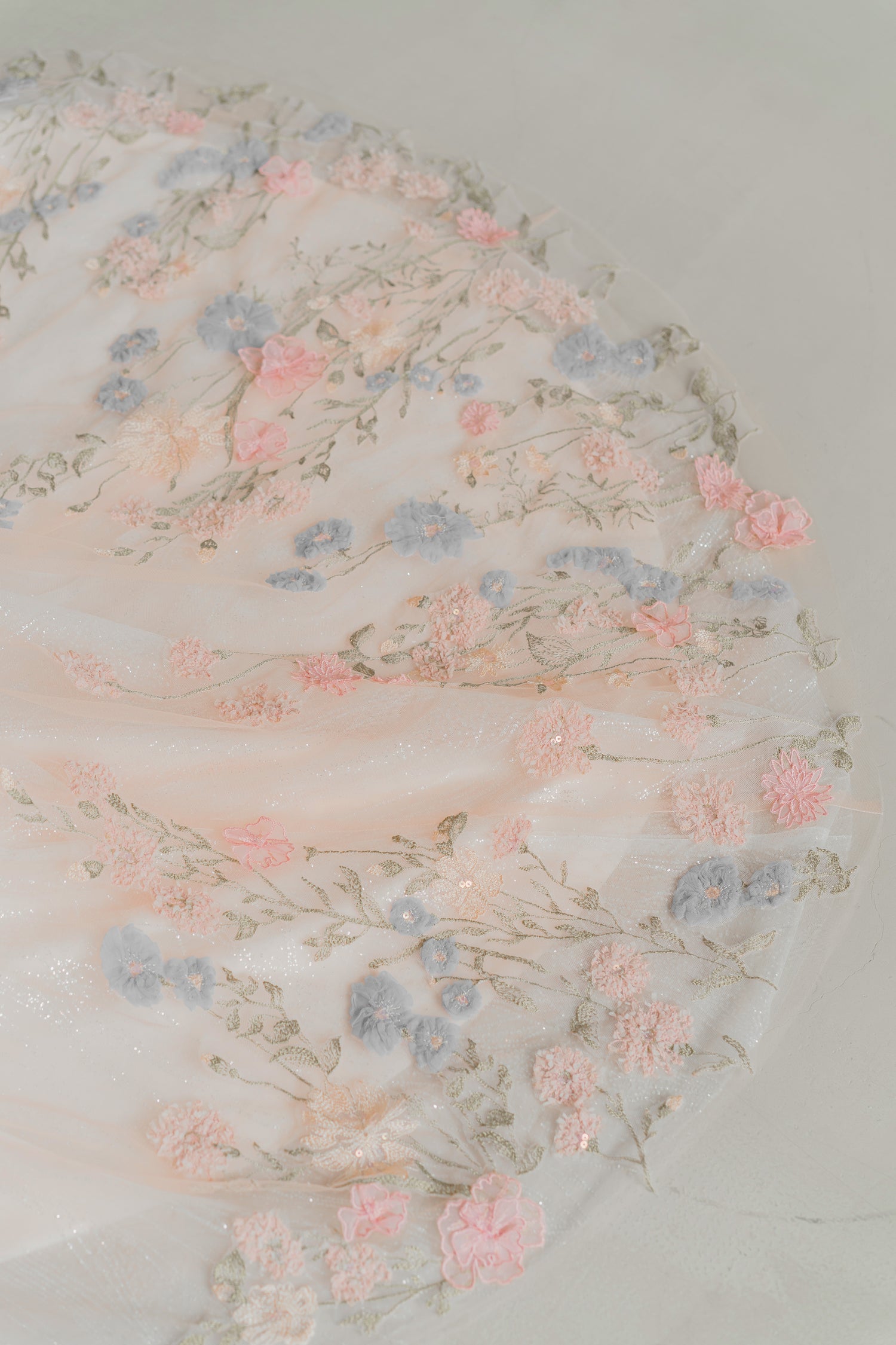 Close-up of Rowan wedding cheongsam highlighting the intricate floral lace detailing