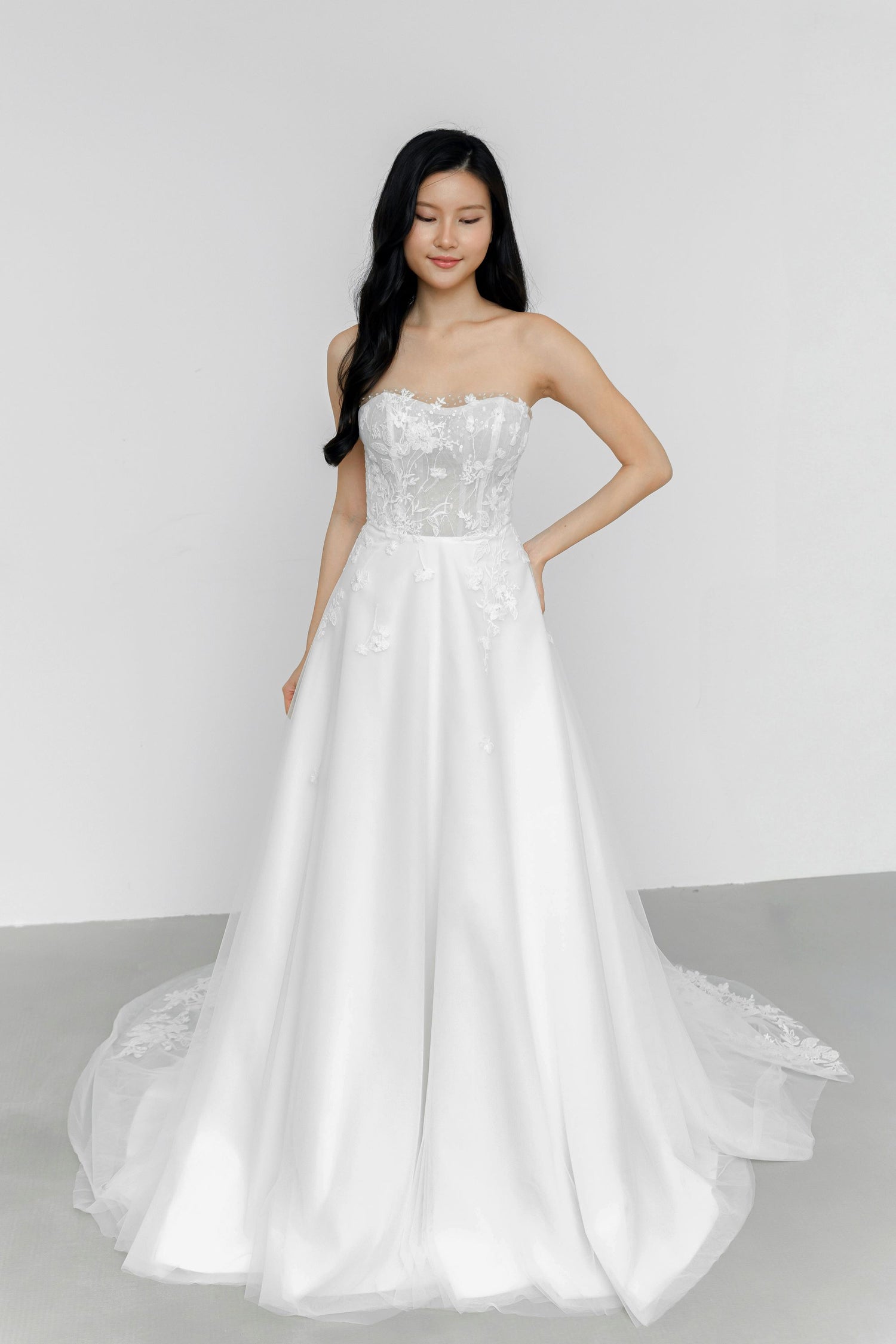 Ruth bridal gown front view with a pearl-embellished lace bodice and flowing tulle skirt