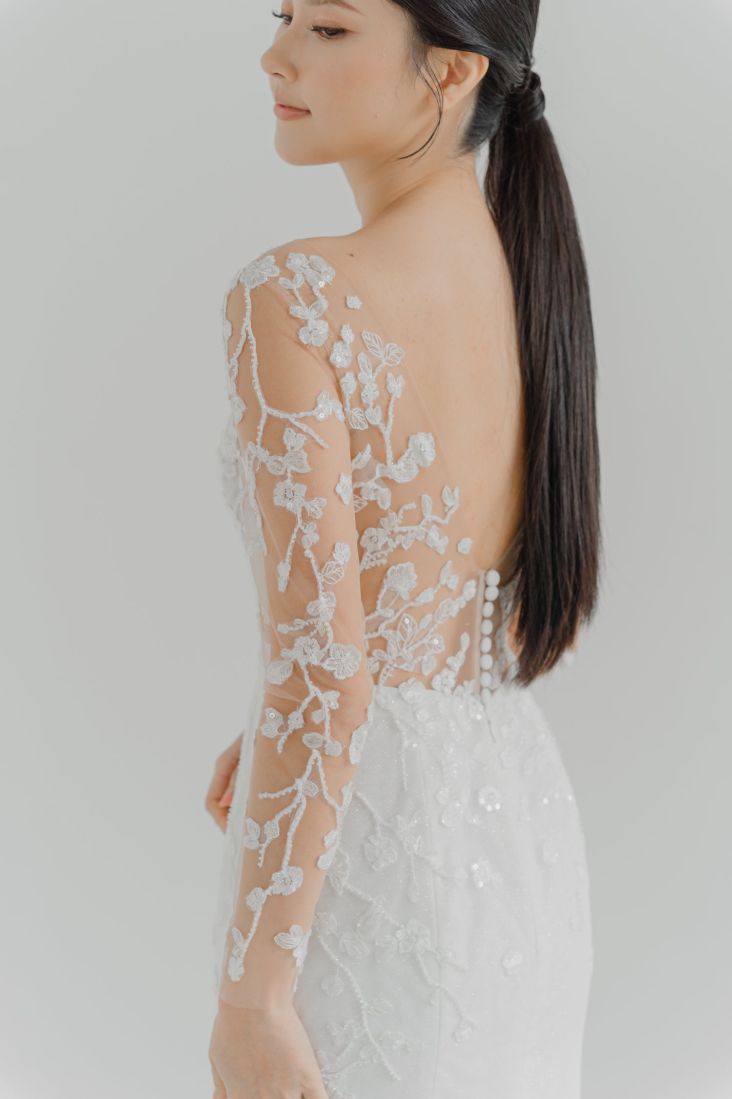 Close-up of Sandra bridal gown showcasing the illusion lace long sleeves